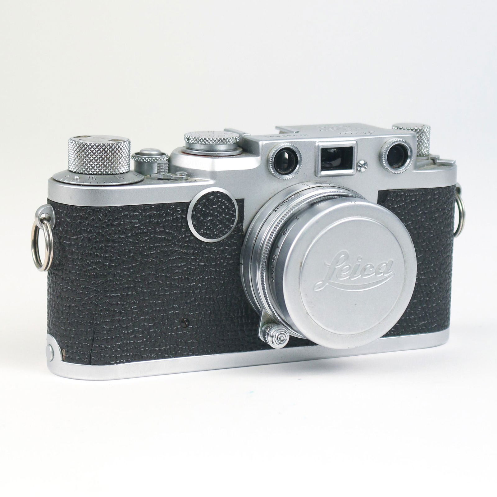 LEICA II RANGEFINDER CAMERA, 788851: metal frame with black grip, Ernst Leitz Wetzlar Summitar 5cm lens, s/n 990747 with cap, top marked "LEICA / DBP/ ERNST LEITZ / GMBH / WETZLAR / GERMANY" and "Nr. 762418" h. 2-3/4 w. 5-3/4 d. 2-3/4 in