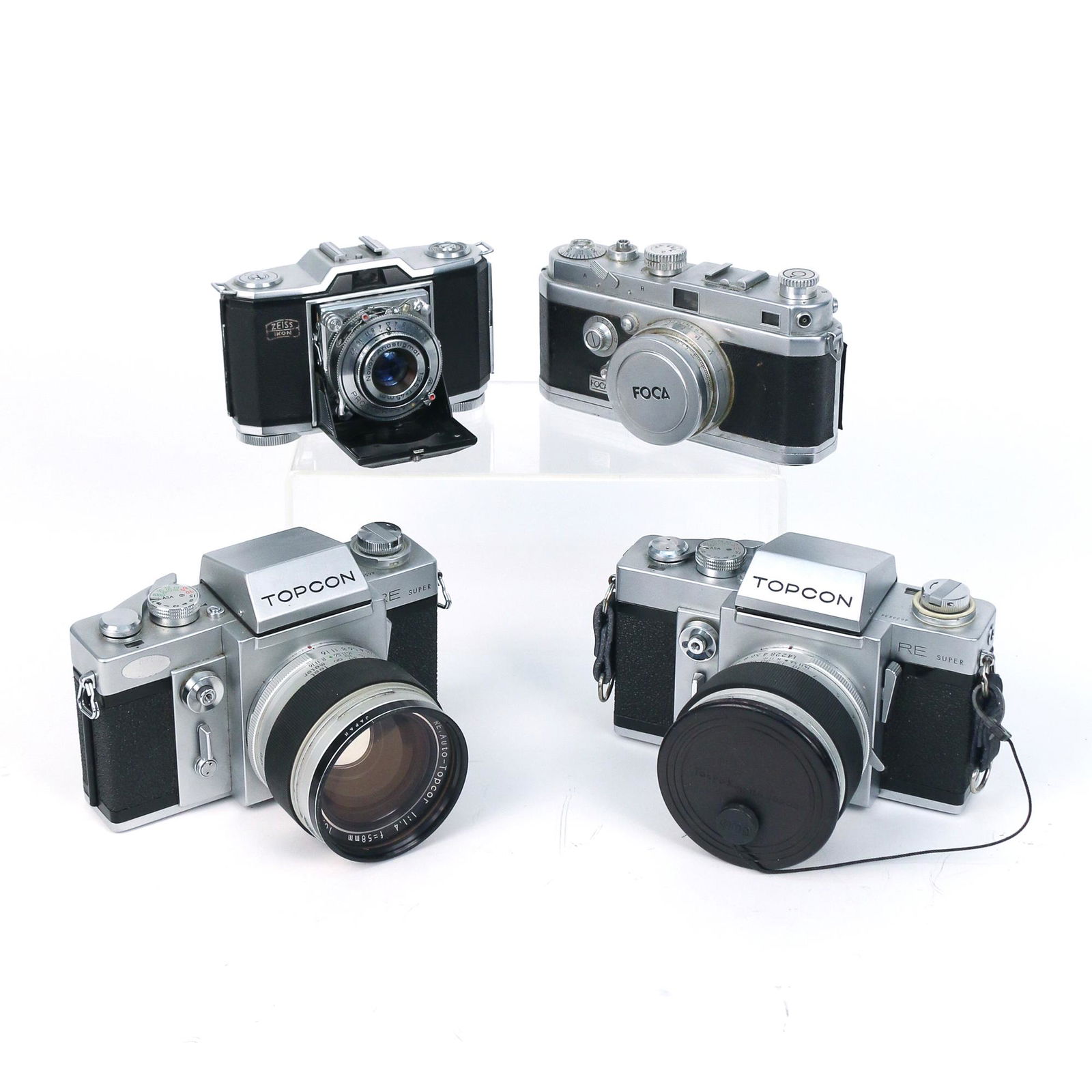 (4pc) MISC. FILM CAMERAS, INCL. TOPCON & ZEISS: including a Zeiss Ikonta camera; a FOCA camera; and two TOPCON RE Super cameras h. 4 w. 5-3/4 d. 4-1/4 in. (TOPCON)