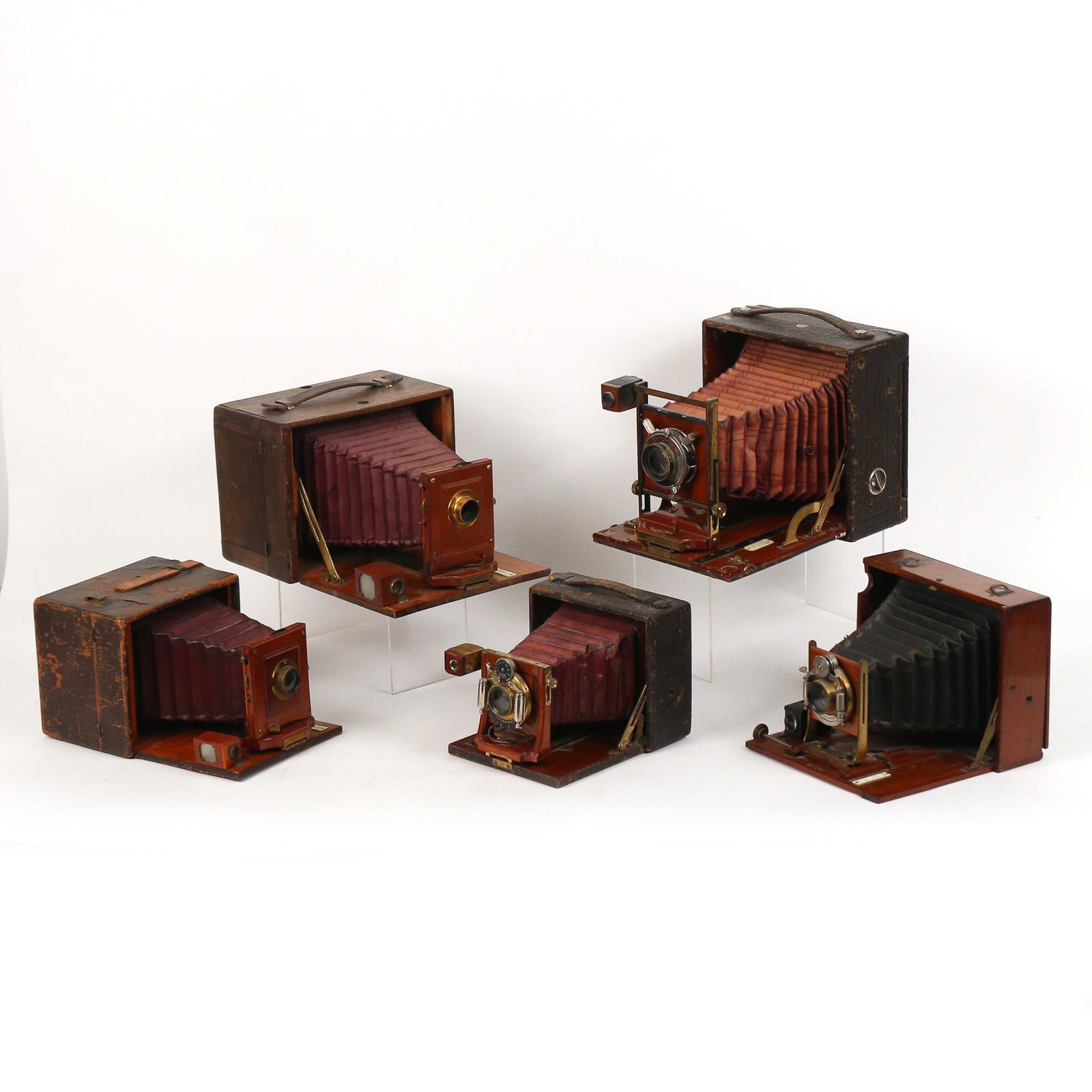 (5pc) MISC. BOX & BELLOWS CAMERAS: including a Pony Premo No. 7 with Vollute lens; two Premo D with unmarked lenses, one with a leather box body and one with a wood box body; a "Challenge" camera with a Bausch & Lomb lens; and a Folmer
