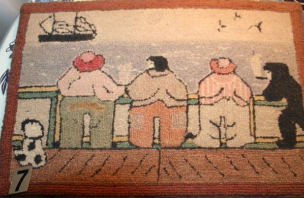 GRENFELL TYPE MAT SHOWING 3 FIGURES & ANIMALS LO