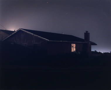 TODD HIDO (American, b. 1968): lanscape with house photographic print h. 19-1/4 w. 23-1/2 in., sight overall: 23-1/2 x 27-1/2 in., frame showing a house with single lit window, matted and framed with no apparent signature Provenanc