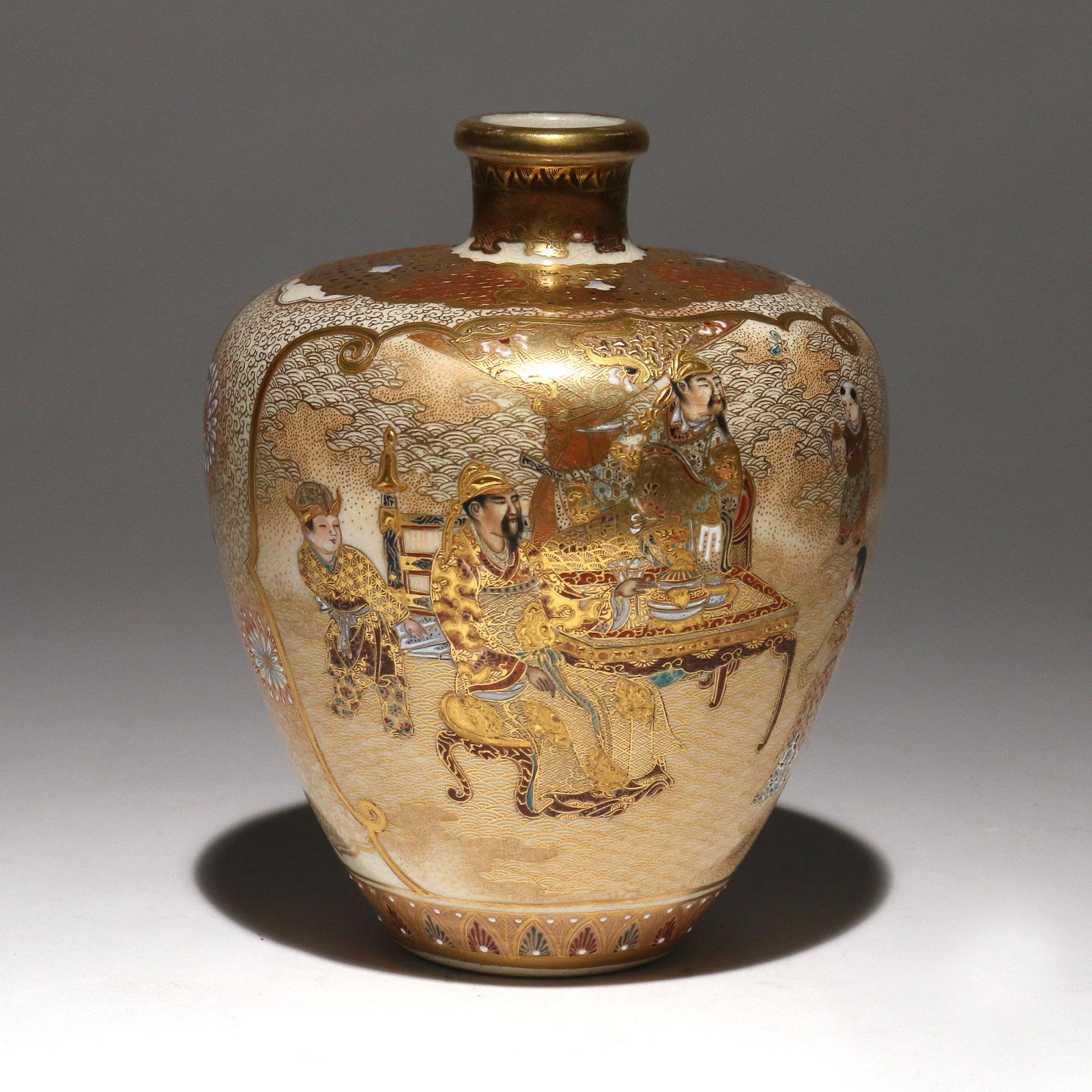 MEIJI PERIOD SATSUMA VASE: raised gilt decoration depicting a regal figure on one side and figures seated at a table on the other h. 5-3/4 dia. 4-1/2 in. Provenance: from the estate of a celebrated gemologist, jade & Asian art 