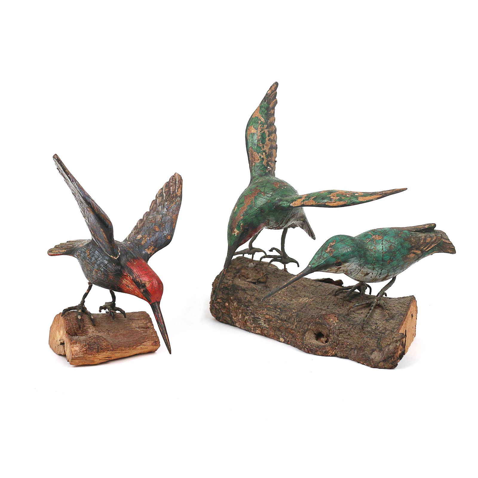 (2pc) CARVED & PAINTED HUMMINGBIRD MINIATURES: two figures, including one of a single hummingbird on a log and one with a pair of green hummingbirds on a log; each signed on the belly "CB" h. 4-1/2 w. 5 d. 5 in. Provenance: items descended through