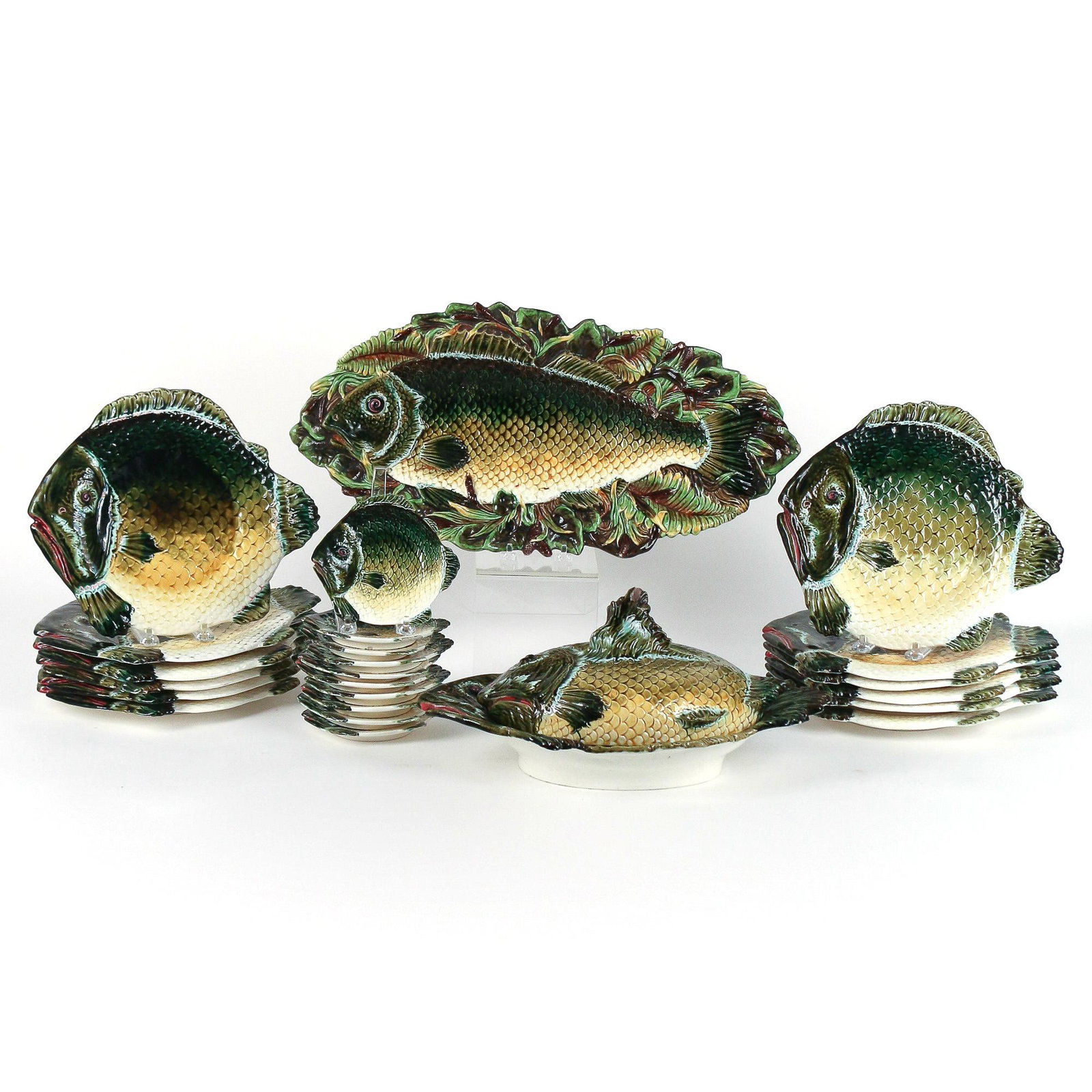 (24pc) DRESSLER MAJOLICA FISH SET: circa 1900, Julius Biela Dressler, designed in matching fish pattern; including a long fish platter with fern leaves and cattails (21 x 10-1/4 in.); a covered tureen (7-1/4 x 15-1/4 x 10 in.); twelve 
