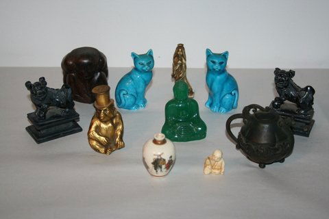 11 PC. MISC. ASIAN GROUP: MINIATURE SATSUMA VASE, 2"; CHINESE BRONZE MINIATURE TEA P0T., 2 3/4"; PR. CVD. HARDSTONE FOO LIONS, 1-DMGD.; PR. TURQUOISE GLAZED CERAMIC CATS; GREEN GLASS BUDDHA; HARDWOOD CARVING OF MONKEY; GILT SP