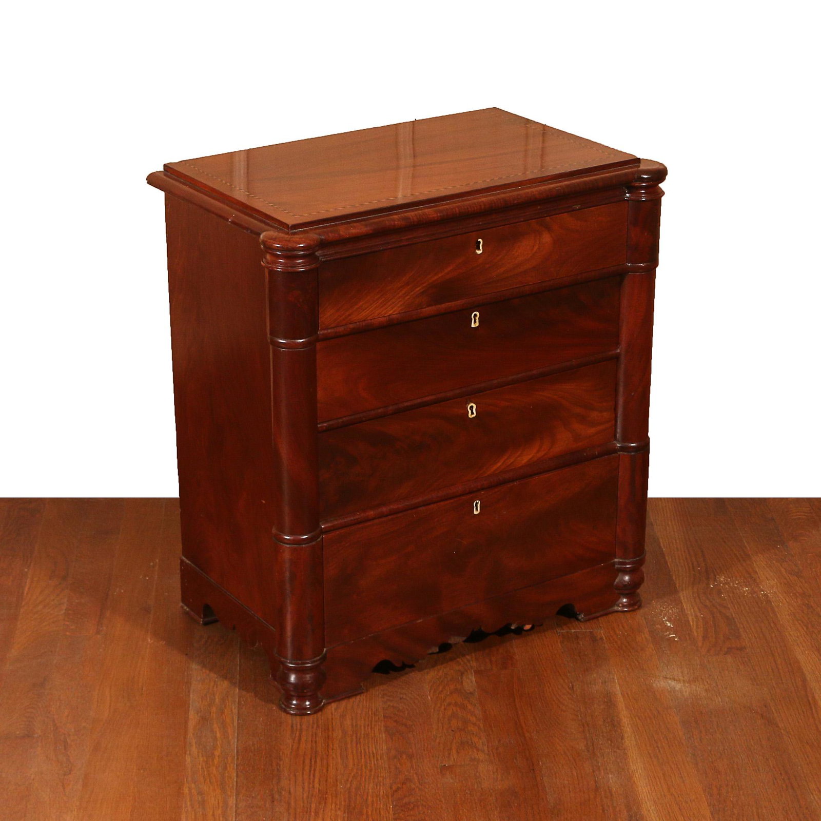 CLASSICAL INLAID MAHOGANY SEWING STAND SMALL SIZE: top with barber pole inlay in contrasting woods, having outset turned columns framing four graduated drawers with bone escutcheons, the top drawer with fitted interior with spools h. 24 w. 22 d. 13-1/
