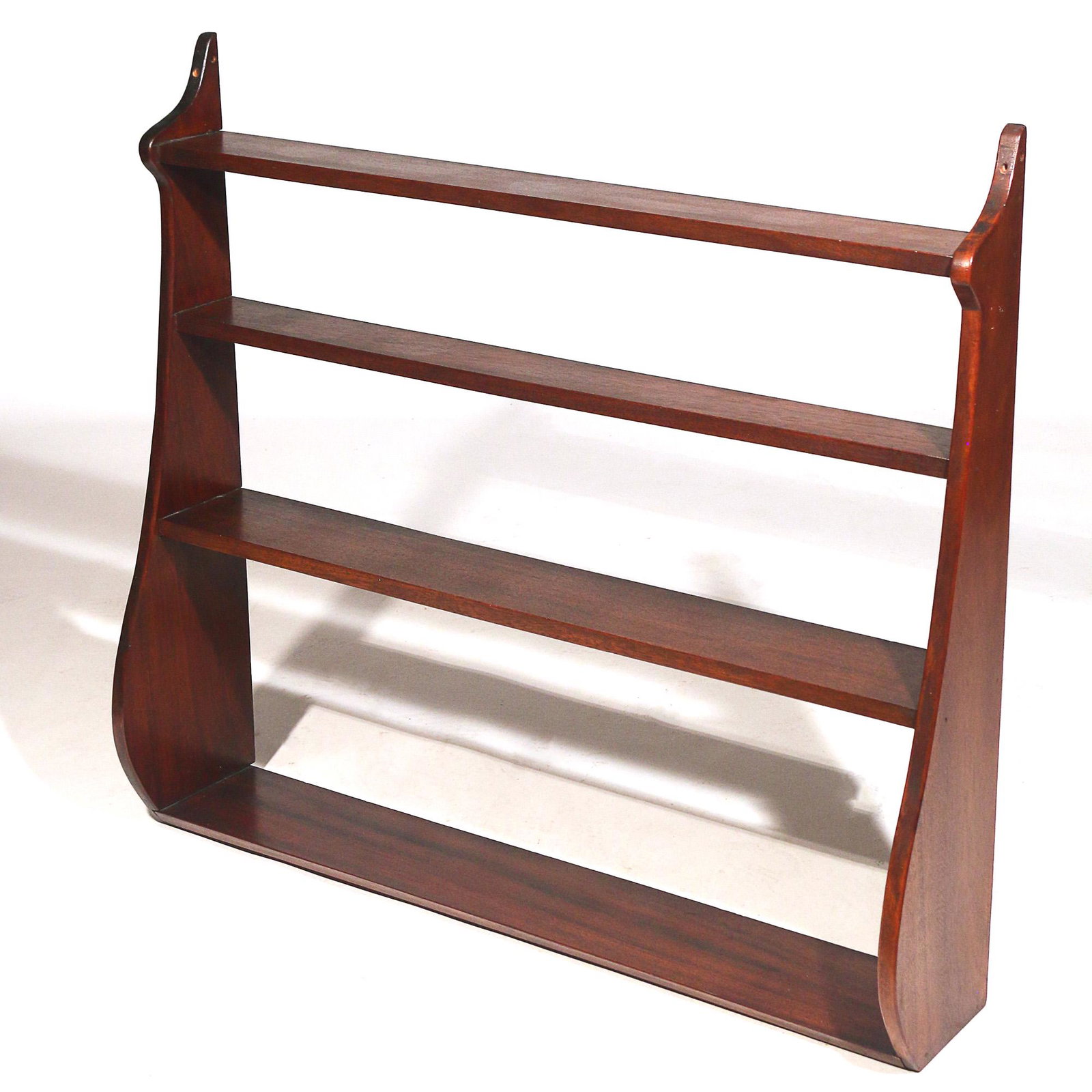 19th C. WHALE END WOOD HANGING WALL SHELF: having four shelves h. 33 w. 36-1/4 d. 8 in. Provenance: descent through the family of a Greenwich, CT Lady Limited Preview: Please note that this auction has a limited in-person preview. Not all item