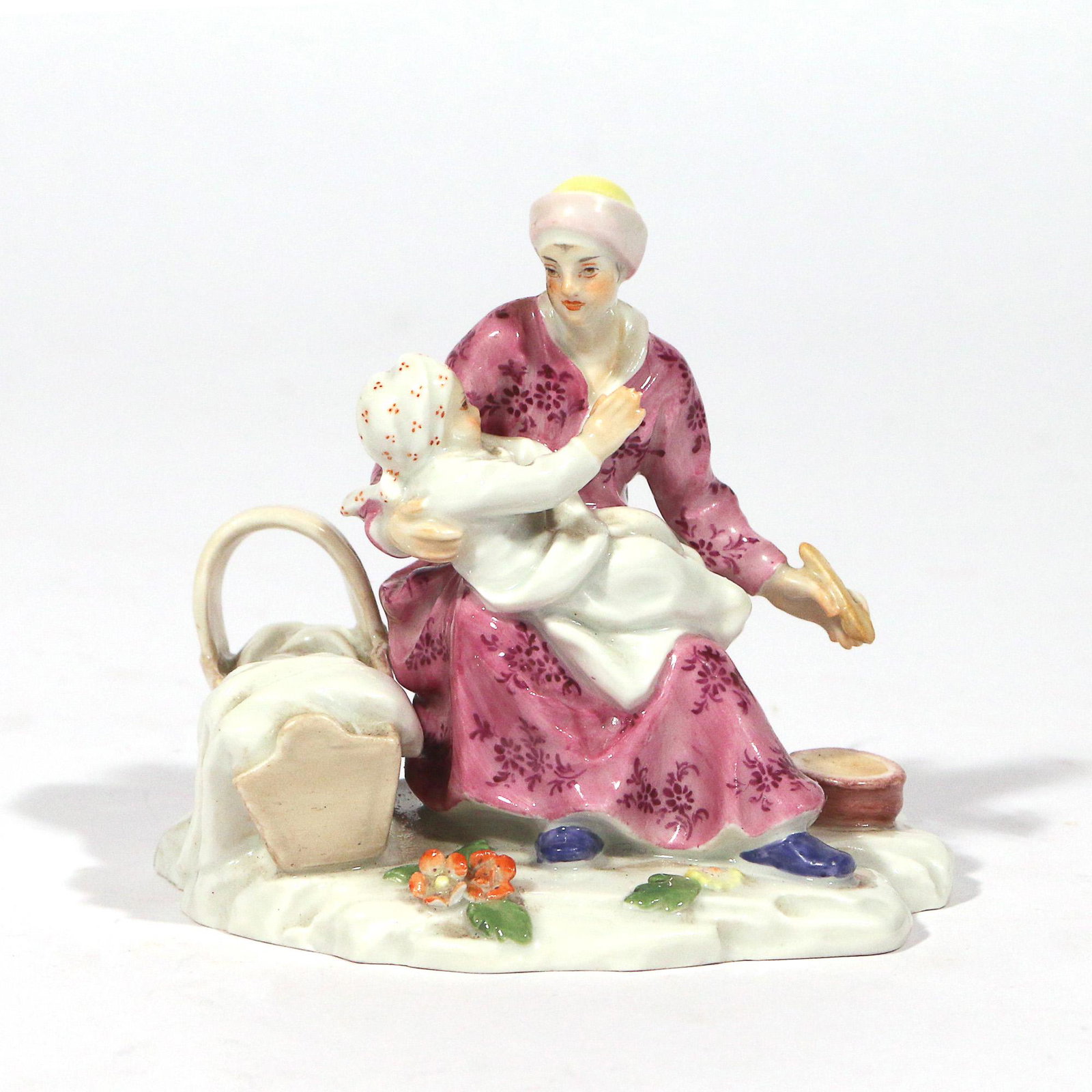 MEISSEN PORCELAIN GROUP: showing a mother and child, with crossed sword mark on bottom h. 3 w. 3-3/8 d. 2-1/4 in. Provenance: from the estate of the late centenarian Joseph S. Blank, Jr., noted collector and former board memb