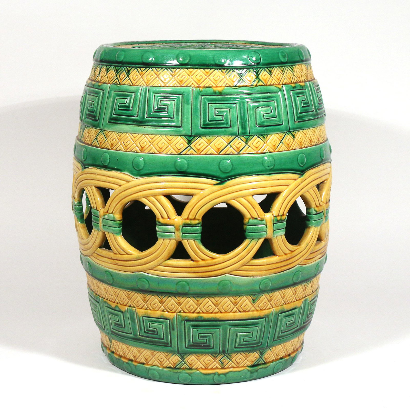 MINTON MAJOLICA GARDEN SEAT, DATED 1863: of barrel form in "Indian Embossed" pattern in green and yellow, with impressed "Minton 772" date mark of 1863 on bottom h. 18 dia. 14 in. Provenance: The estate of a Hartsdale, NY lady Limited Previe