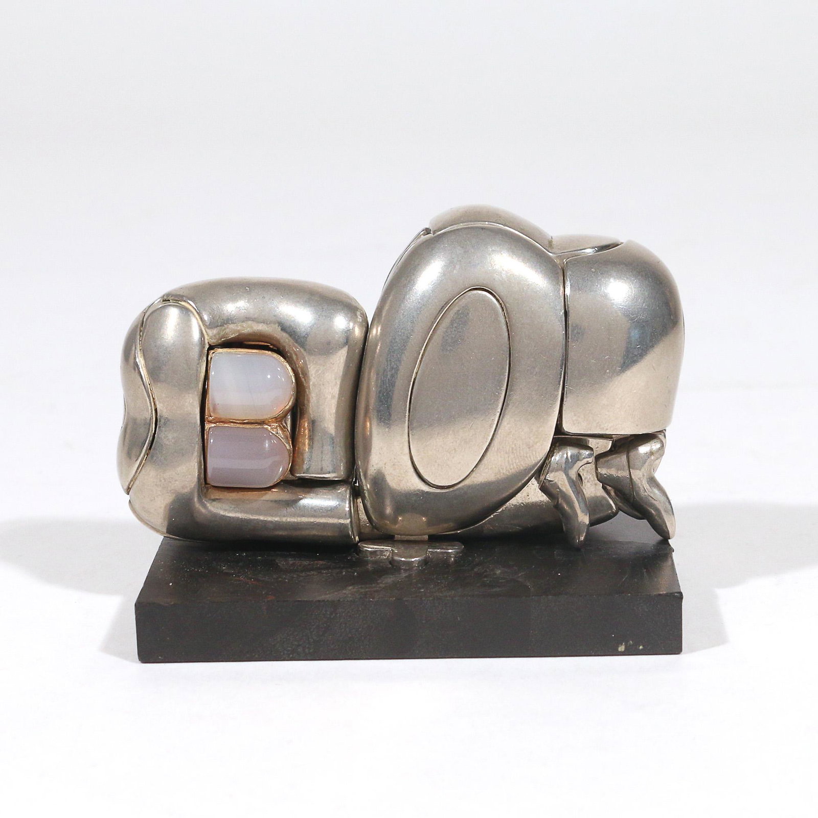 MIGUEL ORTIZ BERROCAL (Spanish, 1933-2006): Mini Zoraida nickel plated metal, agate h. 3-1/2 w. 2-1/2 d. 2 in. With original stand and hardcover book of instructions "a Paloma" Provenance:The estate of an important collector, Manhattan, NY