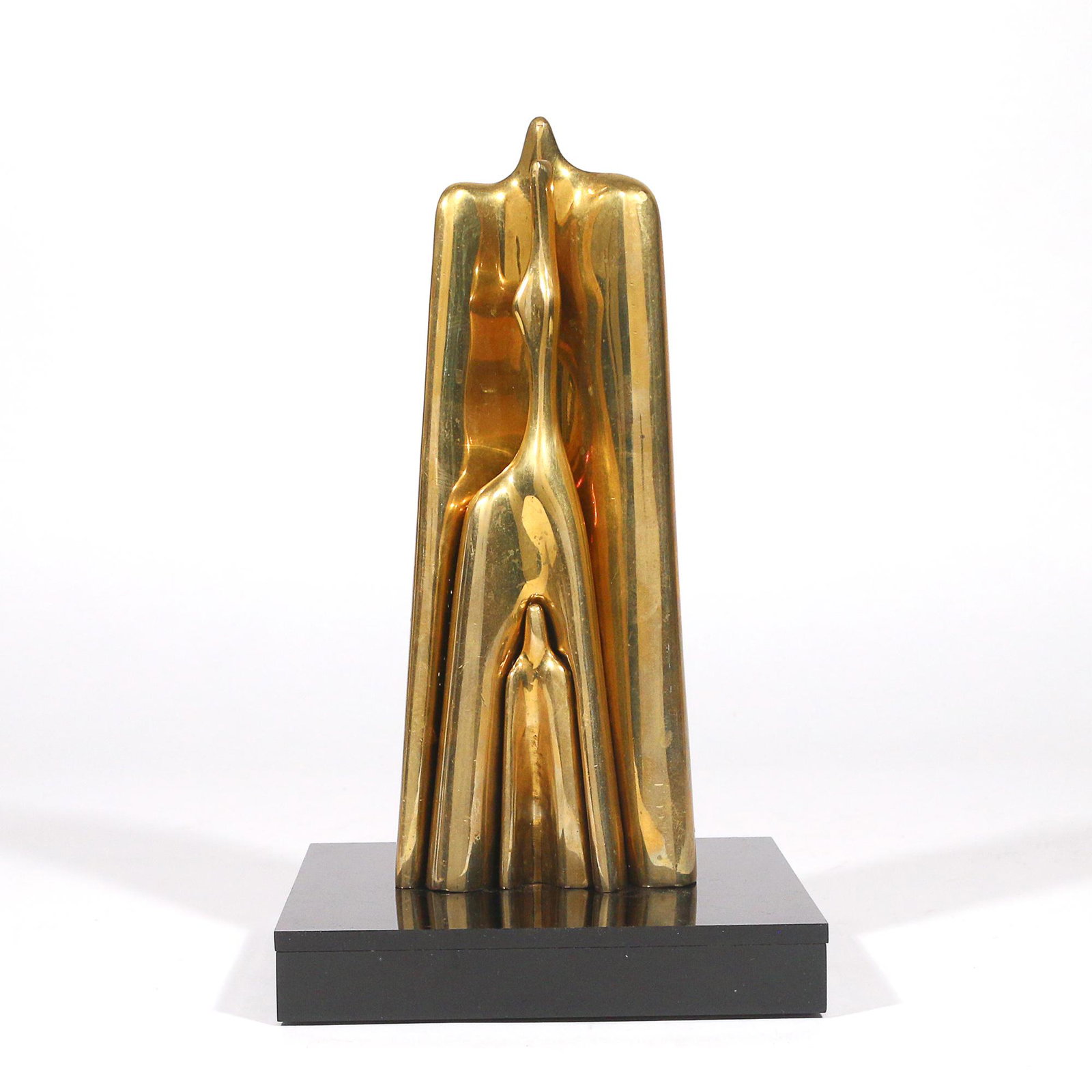 AHARON BEZALEL (Israeli, 1926-2012): Family (Brass) brass h. 10 w. 3-1/2 d. 1-3/4 in. overall: 11 x 9 in. (book) Designed as cast brass nesting figures, the largest with engrave signature, dated '84, ed. 41/100 Provenance:The estate of a