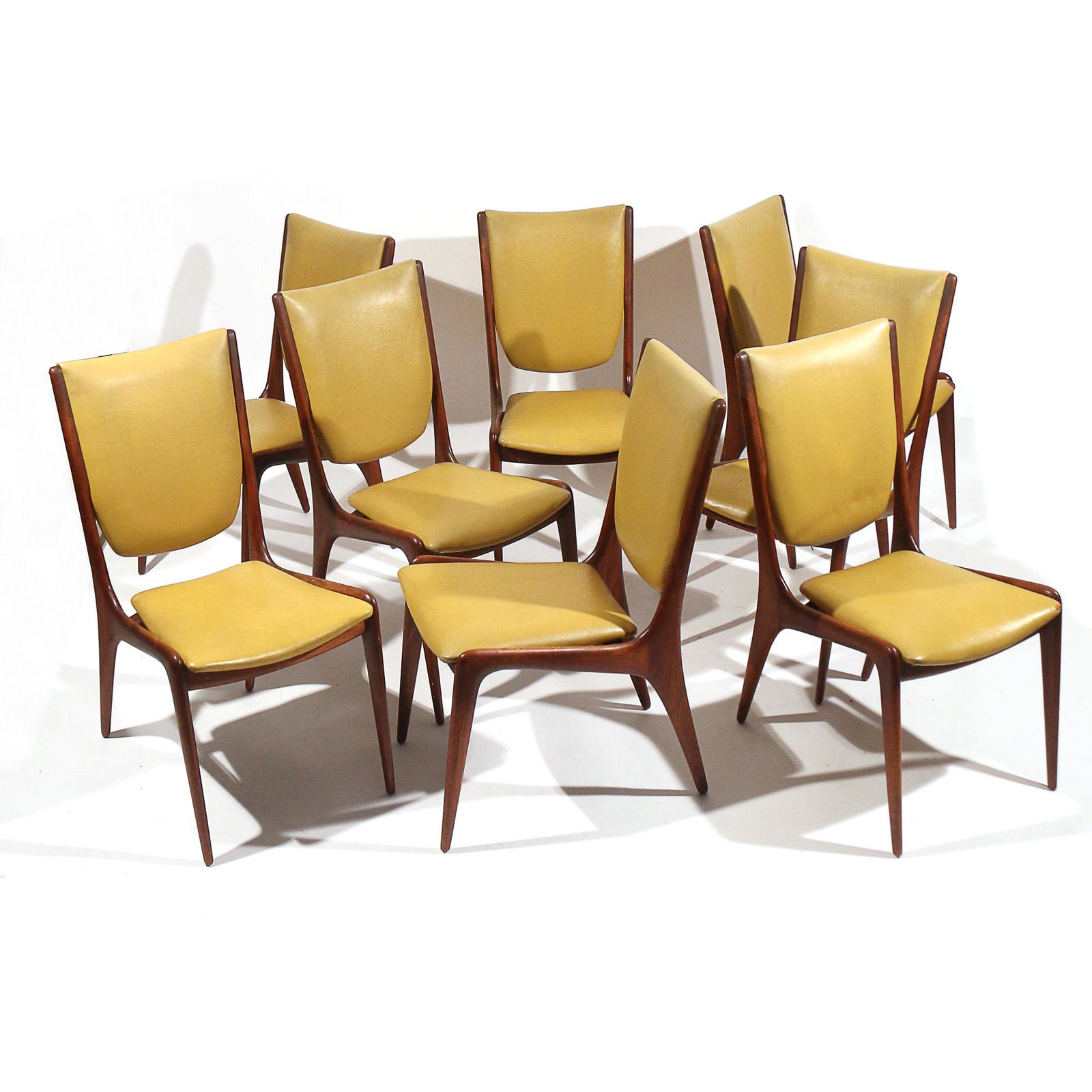 (8pc) VLADIMIR KAGAN / DREYFUSS DINING CHAIRS: Set of eight sculpted side chairs with yellow leather upholstery, all branded "Kagan - Dreyfuss / A Vladimir Kagan Design"; three with Kagan-Dreyfuss, Inc. paper labels h. 35-1/2 w. 19 d. 26 in. (each