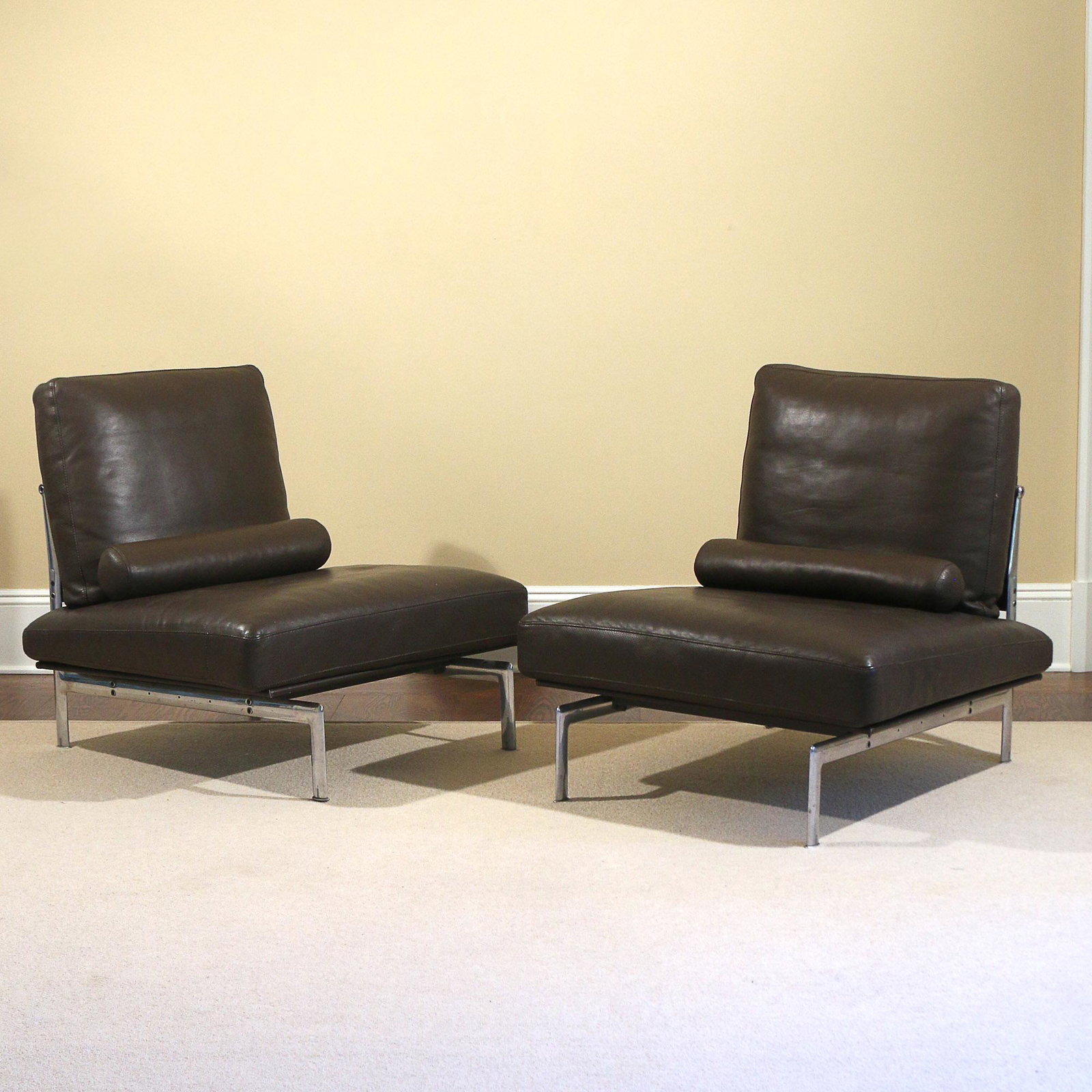 PAIR ANTONIO CITTERIO DIESIS LOUNGE CHAIRS: B&B Italia, Italy, chrome and olive leather; seat height 17 in. h. 33 w. 35 d. 35 in.