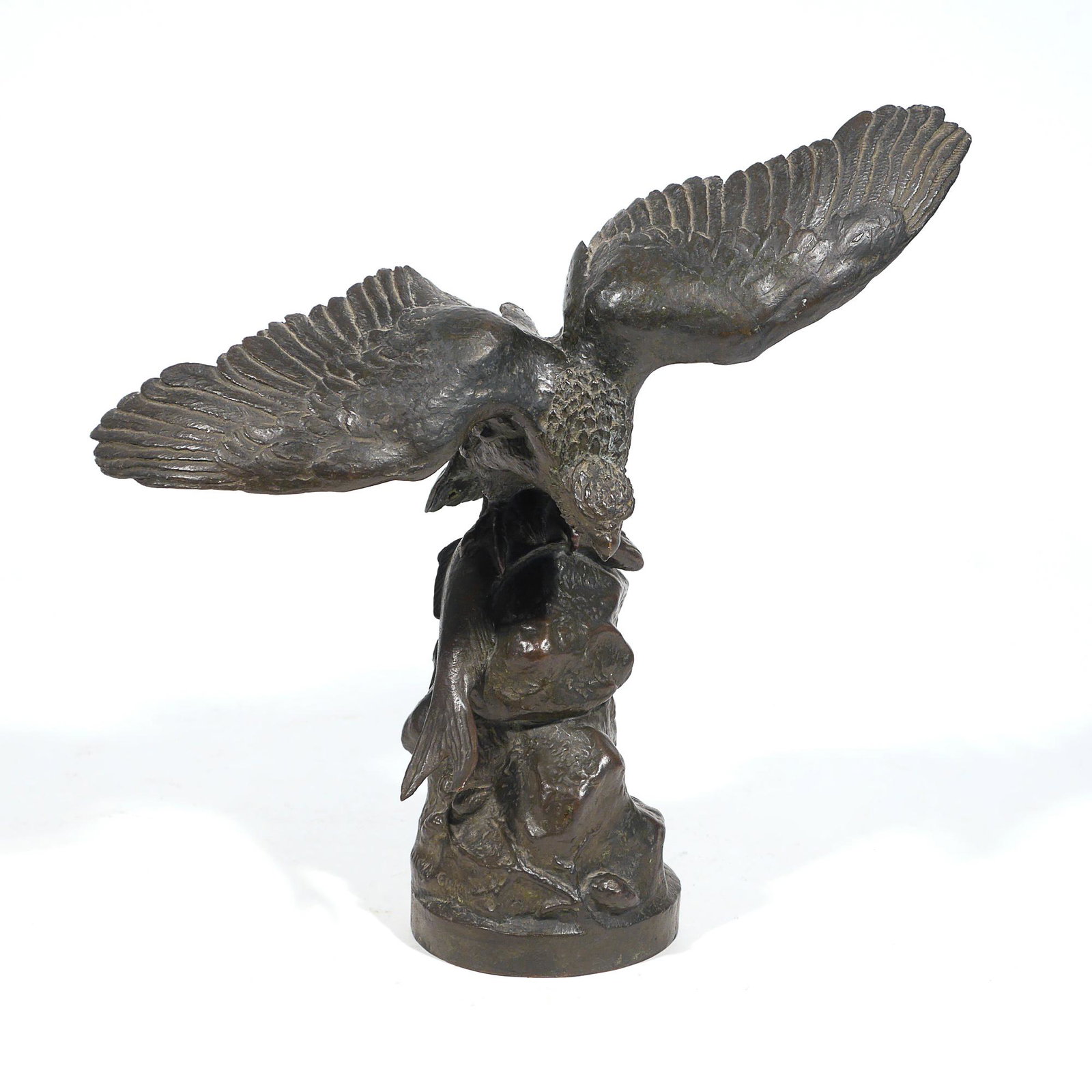 ELI HARVEY (American, 1860-1957): eagle bronze h. 11-1/2 w. 11-1/2 d. 5-1/4 in. Depicting an eagle clutching a salmon in its talons on top of a rock, signed "Eli Harvey / Sc 1908" and inscribed indistinctly "Copyright___"