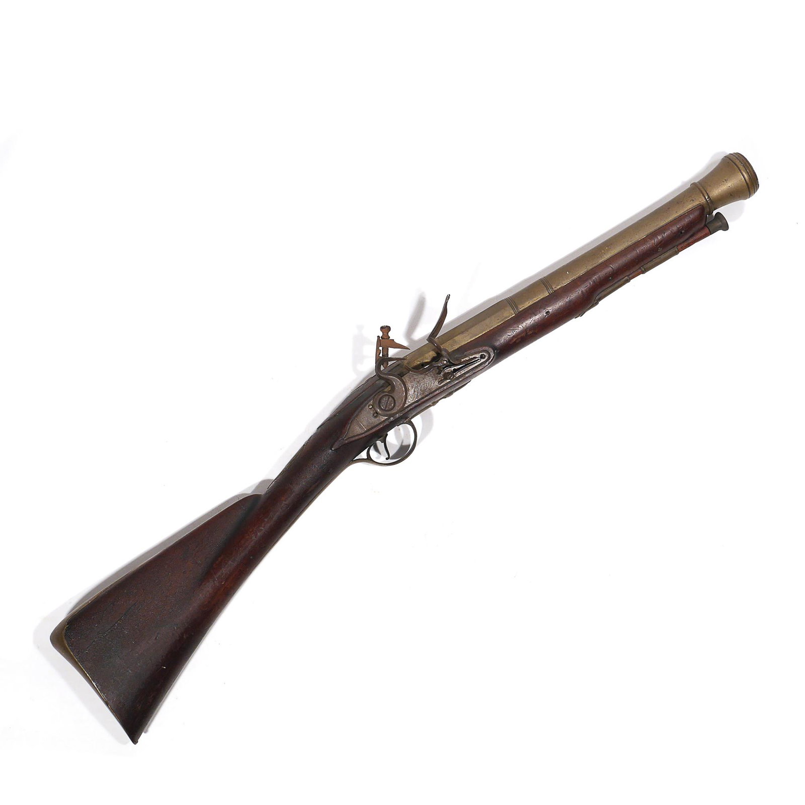 BRASS FLINTLOCK BLUNDERBUSS, GRICE, LONDON: Having a brass barrel transitioning from octagonal to round, signed "London" and with two British proofs (crowns); barrel length14-1/2 in., tapering to 1-1/4 in. interior opening; flintlock mechanism 