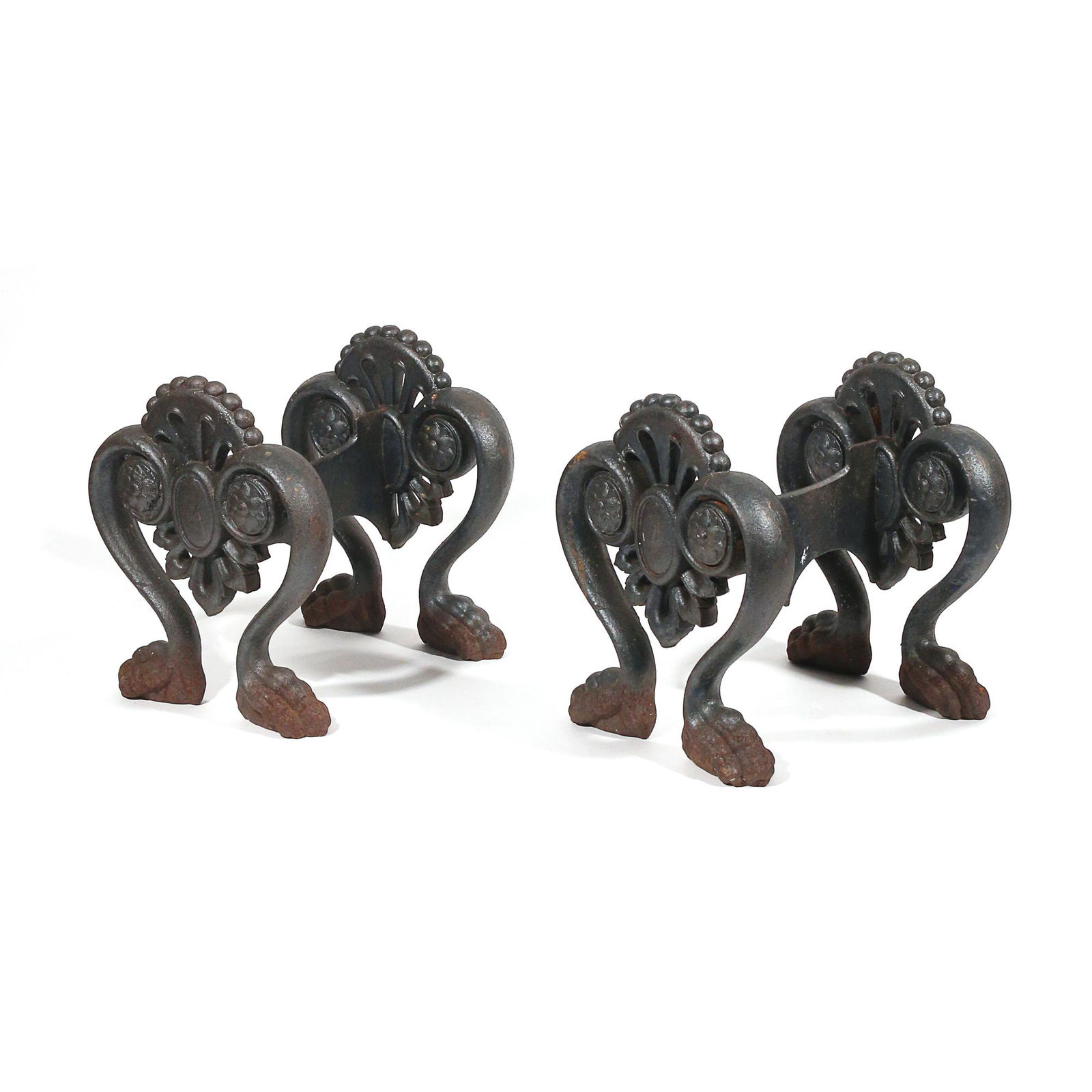 PAIR CAST IRON BOOT SCRAPERS: 19th/early 20th century, with heart-shaped supports terminating in paw feet h. 10-1/2 w. 10-1/2 d. 9 in. Provenance:From the seventy-five acre estate of Mr. Errol Rudman, Bedford, NY