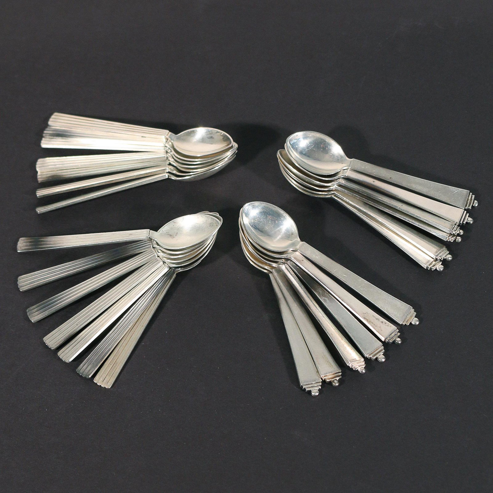(26pc) GEORG JENSEN STERLING DEMITASSE SPOONS: Sterling silver demitasse spoons, including 12 in "Pyramid" pattern (l. 4 in.) and 14 in "Bernadette" pattern (l. 4-1/4 in.); all together 13 ozt Silver