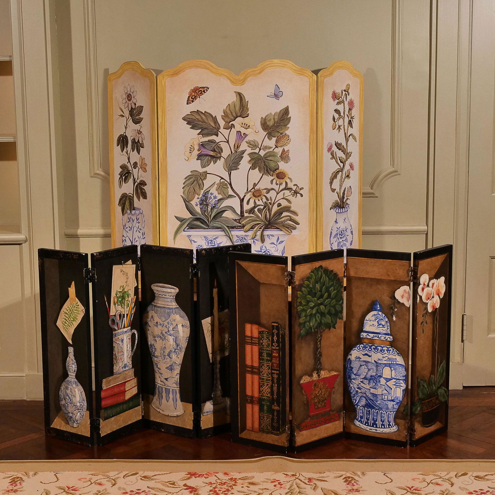 (3pc) HAND-PAINTED SCREENS: including a pair of 4-part table screens hand painted with vases, plants, books, and other desk items on a black background (h. 24 x 36 in.); and a 3-part fireplace screen signed "Susan Welsh, 1996" (