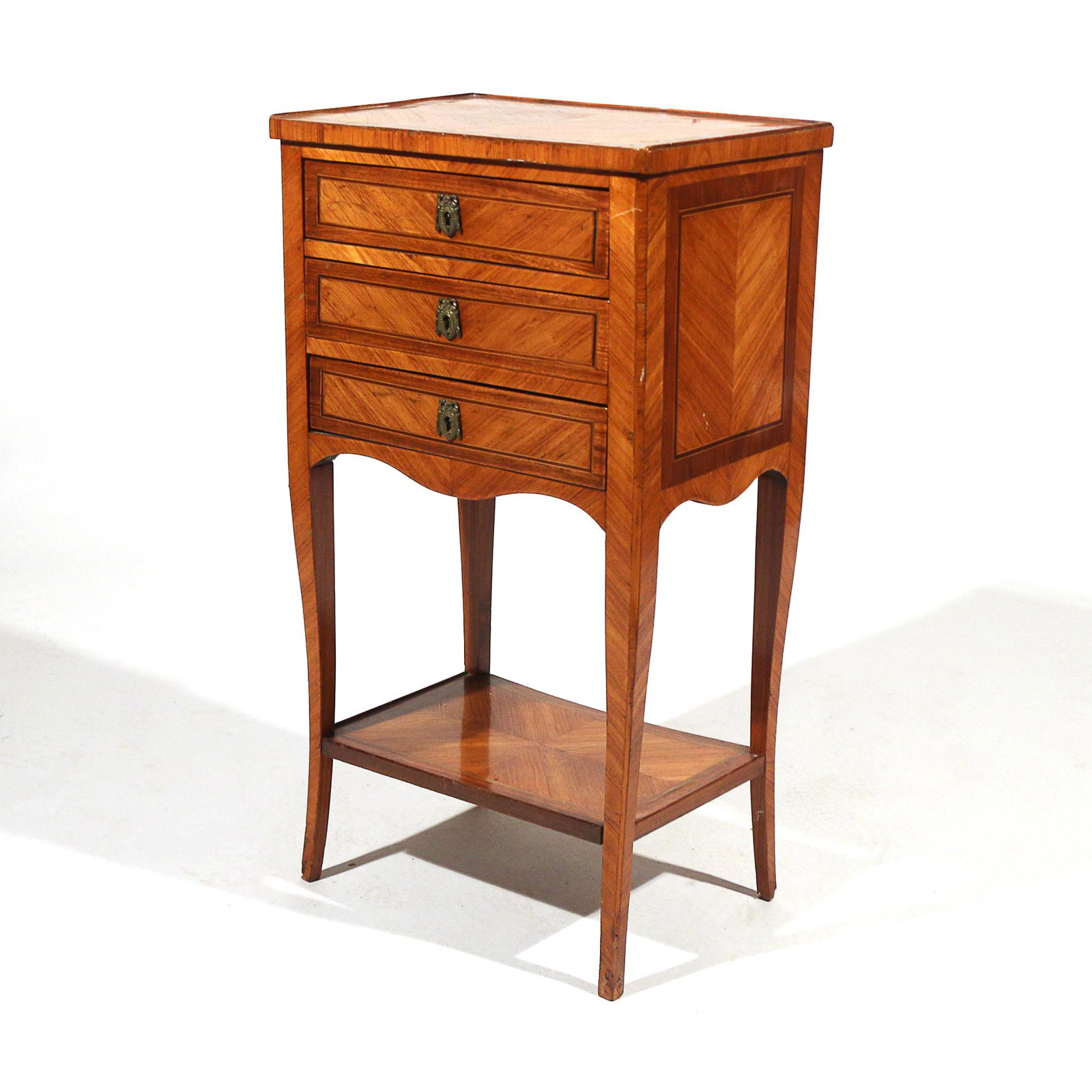 ANTIQUE INLAID & ORMOLU SIDE TABLE EN CHIFFONNIERE: having satinwood inlay with three drawers and sculpted apron over lower shelf h. 30 w. 16-1/2 d. 12 in.