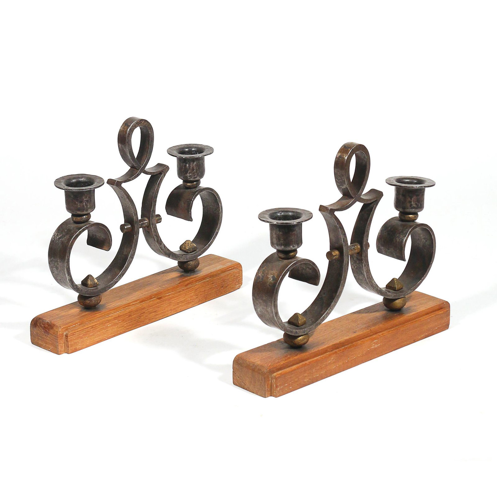 PAIR HAMMERED STEEL CANDELABRAS: mounted on wood stands, marked with a "CP" h. 8-3/4 w. 11 d. 2-1/2 in. Provenance:Private collection, Weston, CT