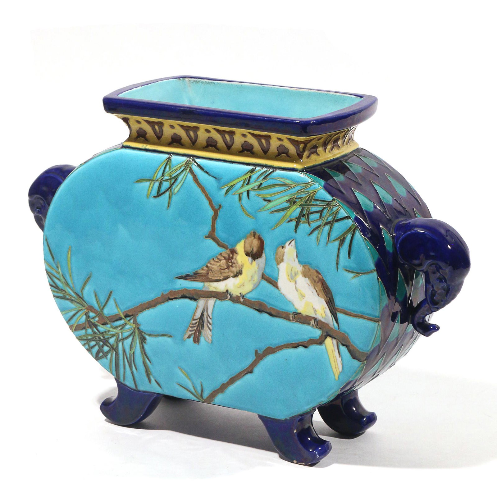 FRENCH SARREGUEMINES MAJOLICA VASE: Early 20th century, footed vase of baluster shape with flat sides decorated with two perched birds one one side with blossoming branch on the other; with elephant head handles; impressed "SARREGUEMINE