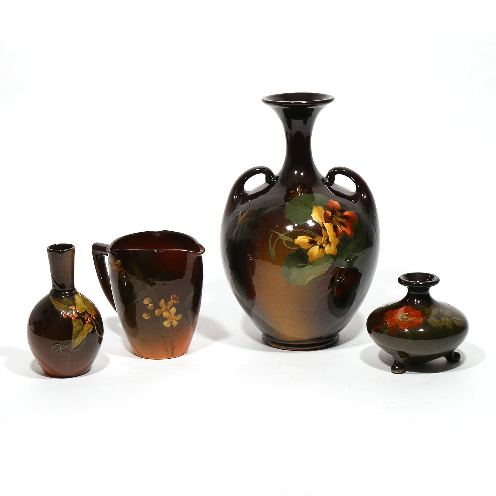 (4pc) ROOKWOOD & WELLER LOUWELSA POTTERY: Early 20th century, all in standard glazes, including a Weller Louwelsa amphora, signed "M. Mitchell", stamped "LOUWELSA / WELLER" and "X280 / 5"; a Weller Louwelsa squat tripod vase, stamped and numb