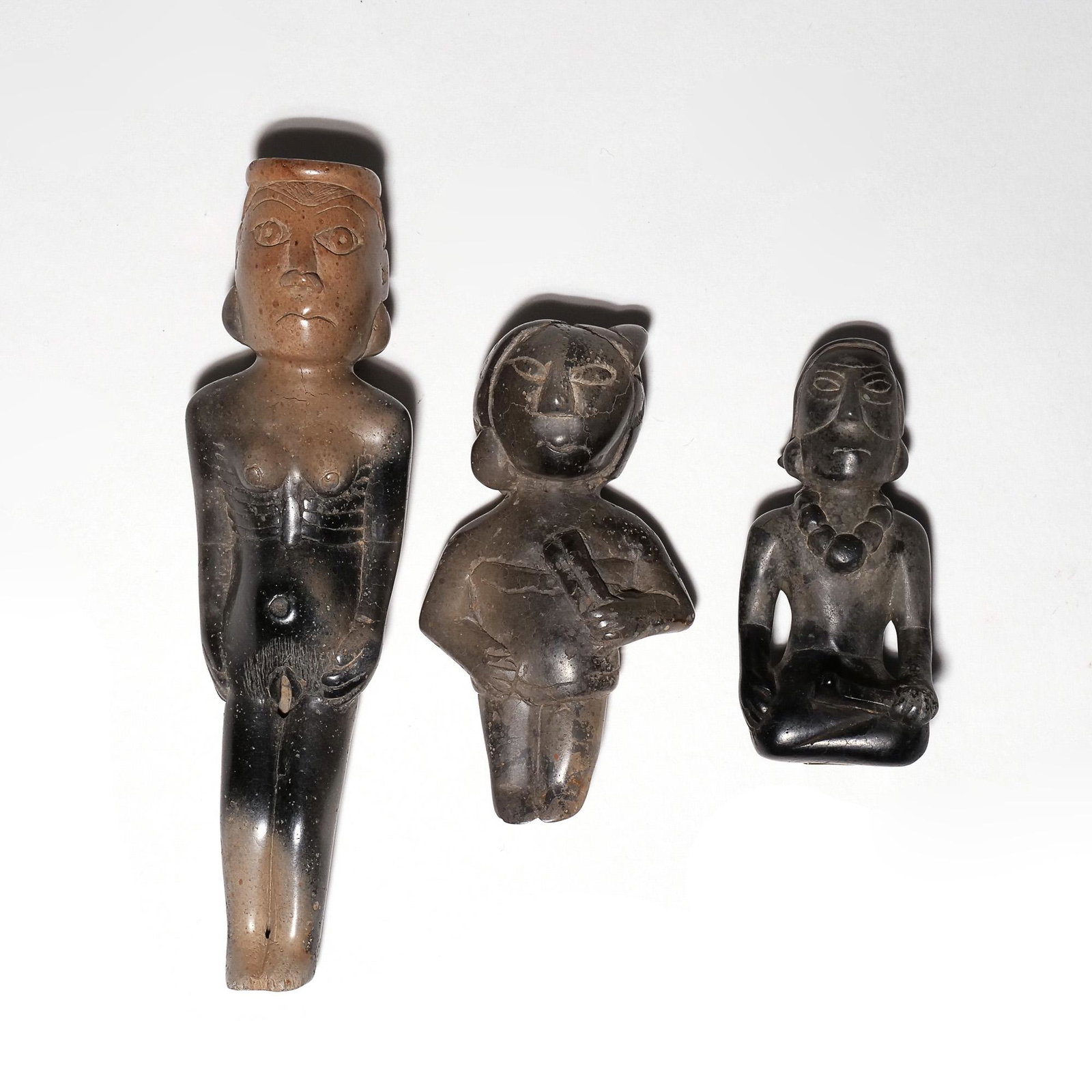 (3pc) NATIVE AMERICAN HUMAN EFFIGY PIPE & FIGURES: Hopewell Culture, Ohio, all carved pipestone, including a pipe carved in the figure of a nude female; a figure of a standing female, old label reading "Pickaway Co. Ohio", and a figure of a seated mal