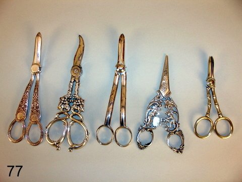 77) LOT: 5 PAIR GRAPE SCISSORS, INCL.: TIFFANY STERLING: SILVER; CONTINENTAL SILVER, SHOWING BARREL MARKERS, NOT MKD.; PLUS SHEFFIELD SILVER PLATE BY WH. HUTTON & SONS; PLUS TO NON MKD. SILVER PLATE