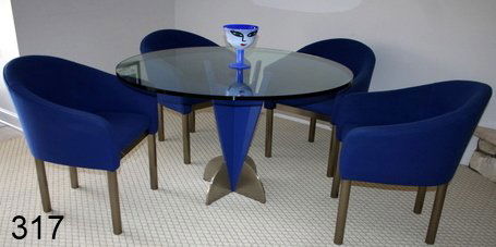 DECO-STYLE ROUND DINING TABLE: POLYCHROMED BASE : SUPPORTING RND. GLASS TOP, W/4-UPHOLSTERED U-SHAPED ARMCHAIRS W/POLISHED STEEL CHROME LEGS, DIA. 4', H.29", CHAIR SEAT HEIGHT 18", OVERALL H.31", N.B. BASE IS REVERSIBLE, COND.: GLASS TOP W/SM. CHIP U