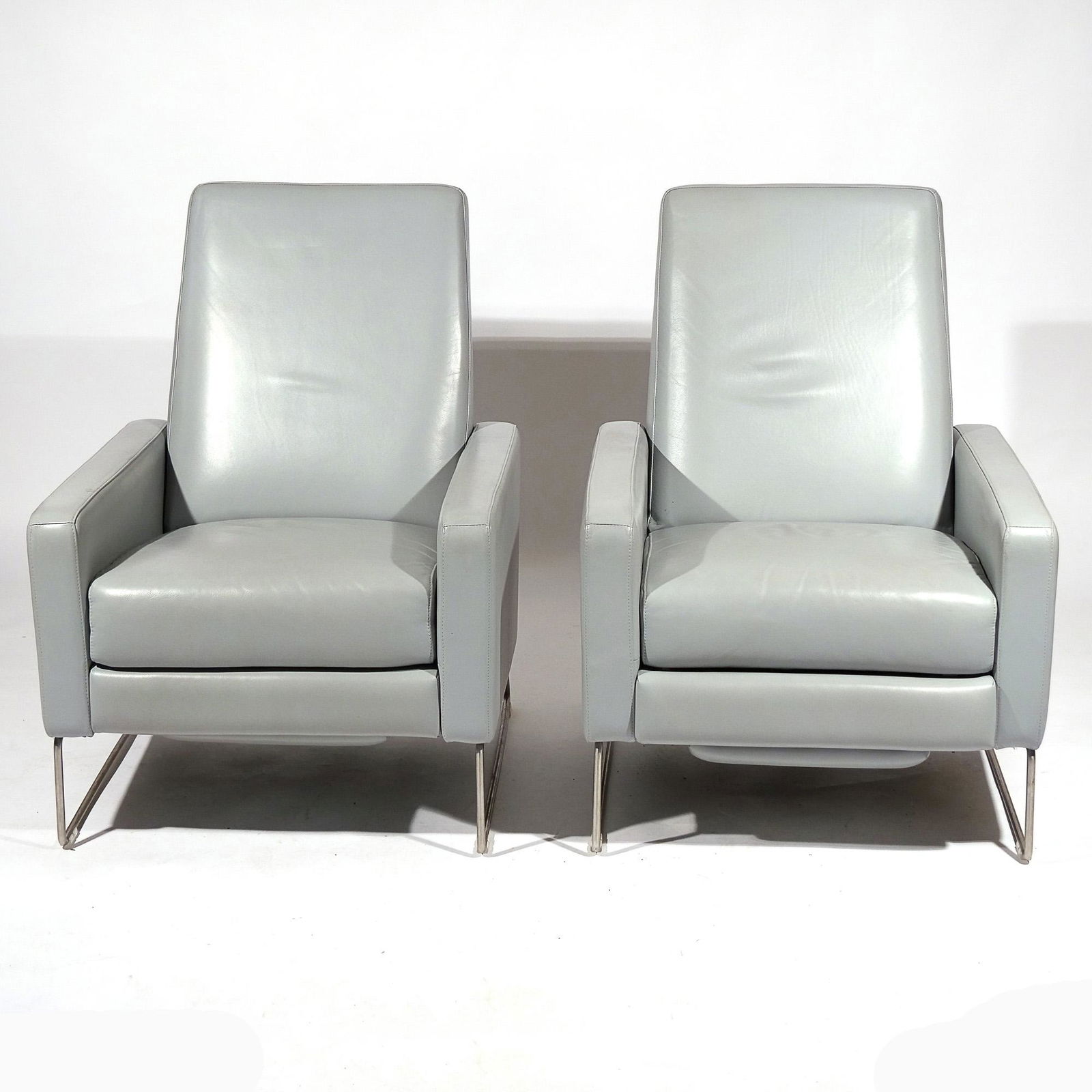 PAIR BERNETT / DODZIUK FLIGHT RECLINERS: Made in USA for Design Within Reach, dove gray leather, tubular chrome frame h. 37 w. 28 d. 33 in. Provenance: Items from a private home, Manhattan, NY and Falls Village, CT IN SITU ITEM: This lot is