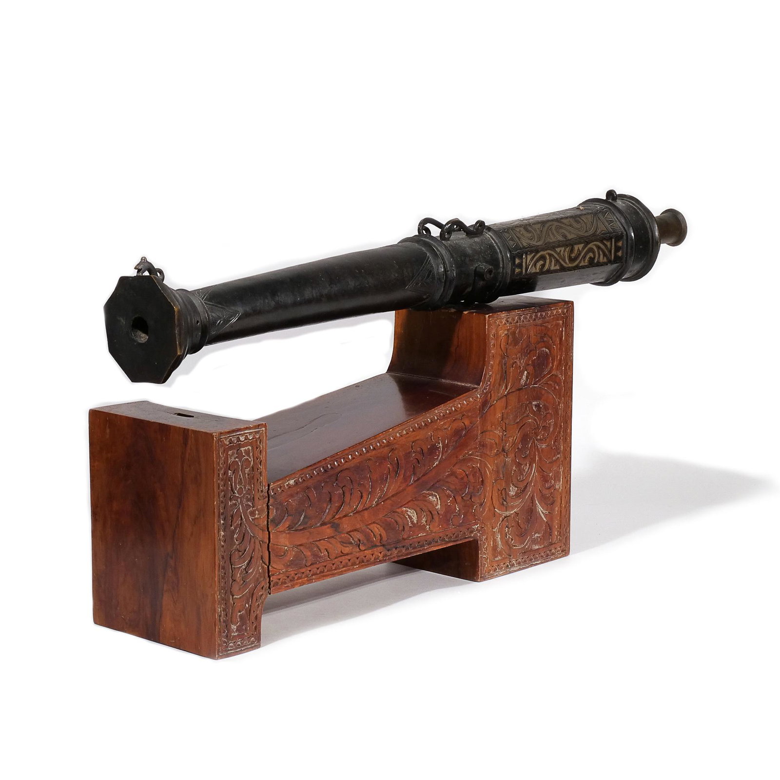 ANTIQUE MORO SIGNAL CANNON: Philippines, 19th century, with chased geometric scrollwork in contrasting metals, affixed to a carved rosewood base h. 17-1/2 w. 36 d. 8 in. (overall) Provenance: From a Greenwich, CT couple