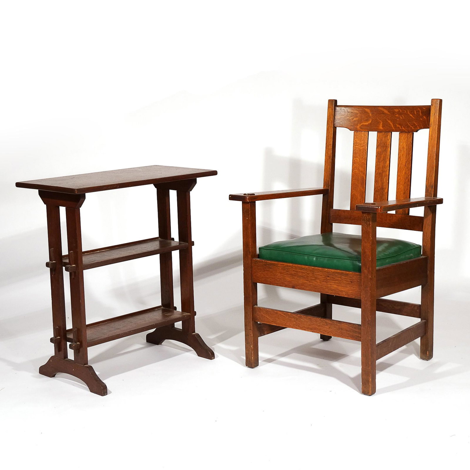 (2pc) ARTS & CRAFTS: STICKLEY BROTHERS: Including an open arm chair with original seat and "Quaint" Furniture, Grand Rapids label and partial Stickley Bros. Co. oval label (h. 39 x w. 26 x d. 22 in); plus a Roycroft Little Journey bookstand