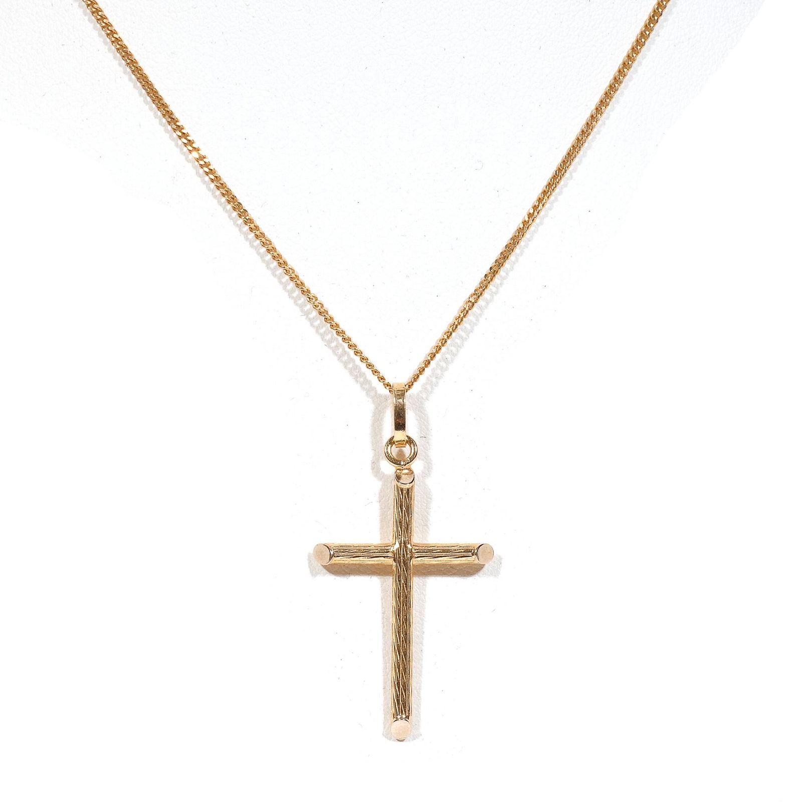 18k GOLD CROSS & CHAIN: A yellow gold cross pendant, stamped 750 (approx. 1-1/2 x 7/8 in.) on an 18k chain (l. 20 in.); total weight 6.4g Provenance: Descended through a prominent Greenwich, CT family
