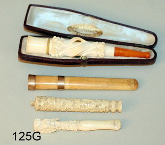 125 G) 4 PCS: AMBER & IVORY CIGAR HOLDER, OVERALL L.4 : 3/4"; CARVED IVORY NEEDLE HOLDER, L.3 1/4"; CIGARET HOLDER W/14KYG BANDING, L.4"; CARVED IVORY CIGARET HOLDER, L.3"