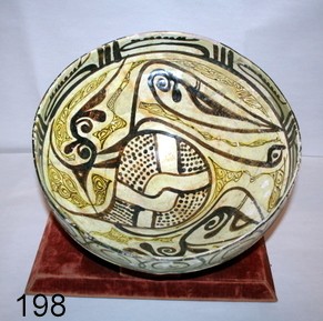 198) ANCIENT PERSIAN FAIENCE GLAZED BOWL; D: 12.5" : H: 5 5/8" LABEL SAYS: NISHAPUR 9-10TH C. A.D. NE IRAN; W/ EXTENSIVE RESTORATION;