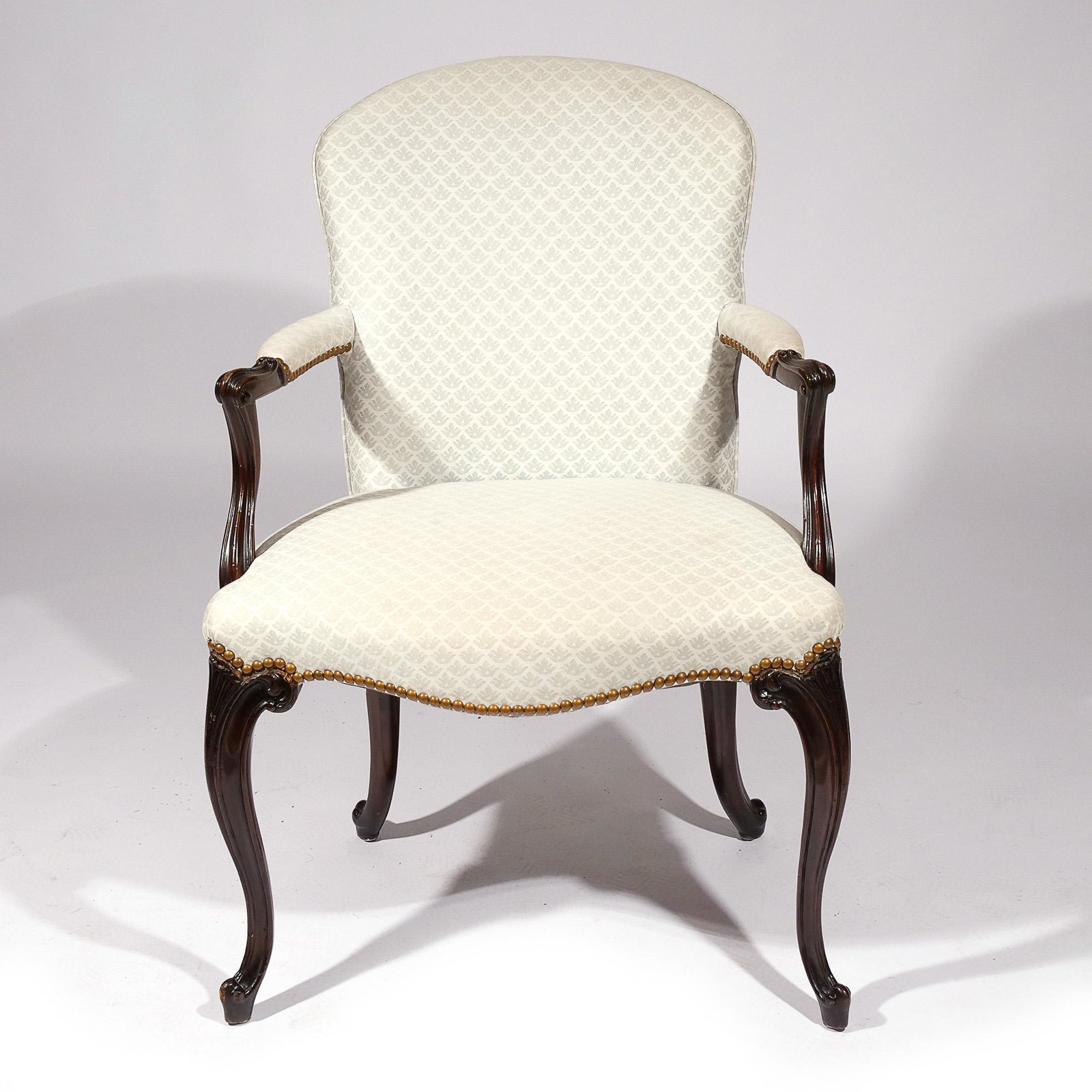 LOUIS XVI-STYLE FAUTEUIL: With allover white upholstery and padded armrests h. 36 w. 25 d. 22 in.