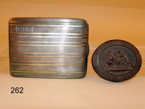 262) STERLING SILVER CIGARETTE CASE W/BANDS COLORED : GOLD;PLUS OVAL GUTTA PERCHA PHOTO FRAME W/EXOTIC SCENE OF WOMEN W/ANIMALS