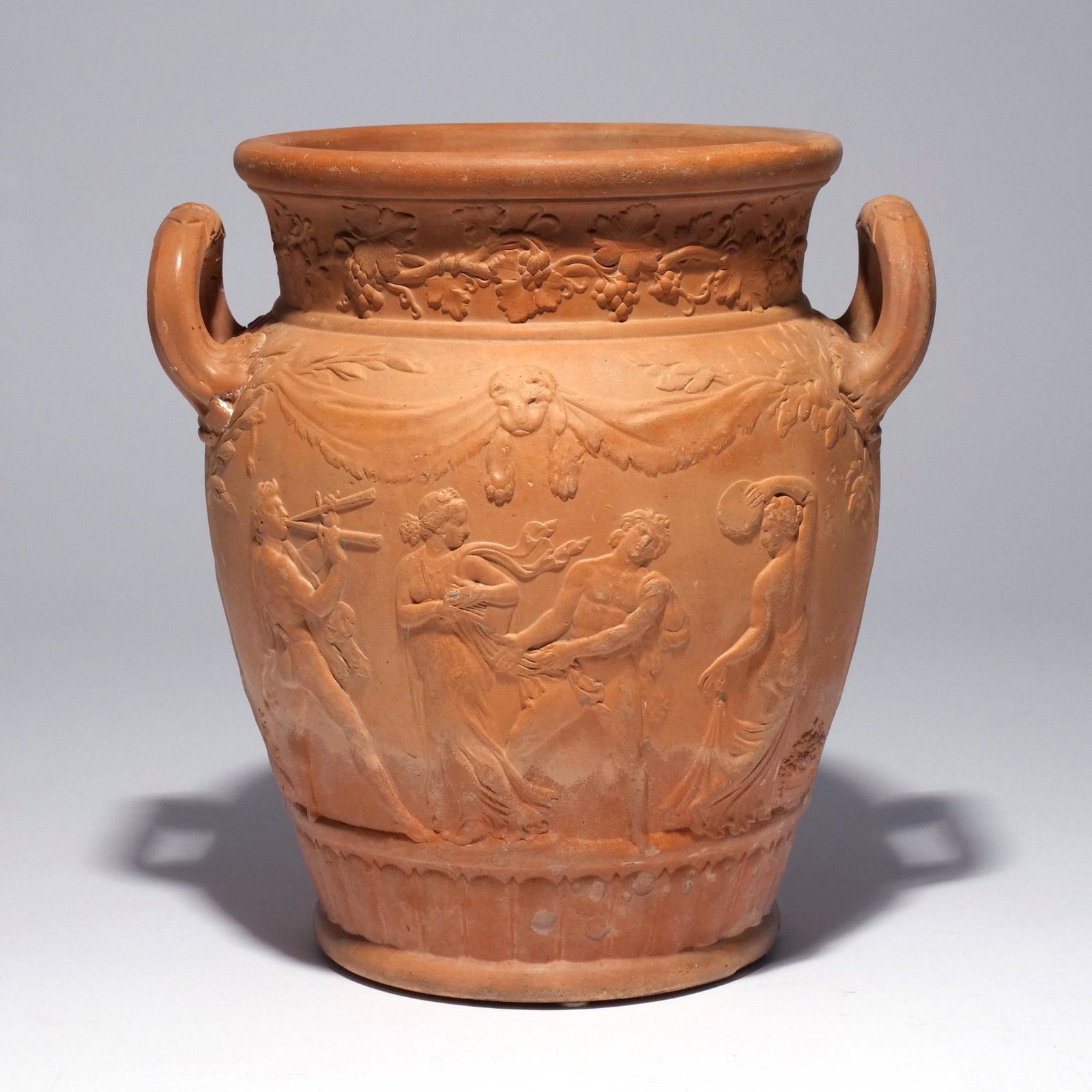 RARE WEDGEWOOD TERRACOTTA WINE COOLER: Circa 1840, of ovoid shape with double handles and sculpted decoration showing a "Bacchanalian Triumph", incised WEDGEWOOD on base h. 10 in. Provenance: From the private collection of a New Canaan, CT