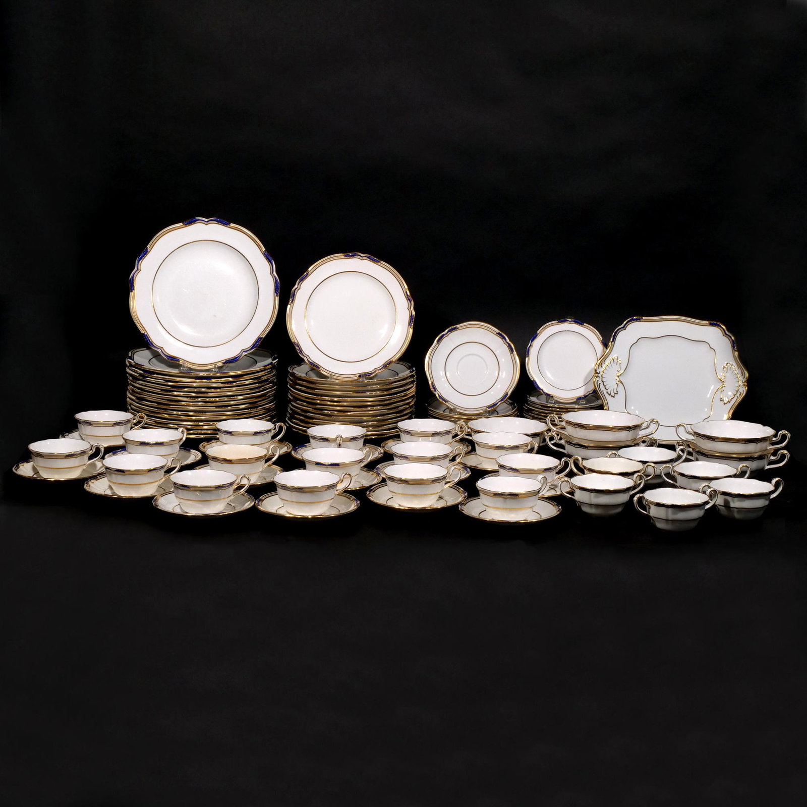 (89pc) SPODE COPELANDS CHINA DINNER SET: Cobalt and Gold fine bone English china, including: 15 dinner plates (dia. 10-1/2 in.), 1 serving plate, 16 cups and saucers, 6 soup cups and underplates, 5 large soup bowls, 11 bread plates, and 13 d