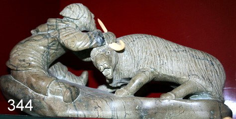 344) STONE SCULPTURE, MUSK OX & HUNTER BY LUKE AIRUT: (BORN 1942 - ),igloolik, NWT, CANADA; NUMBERED 19170, L.17" X 8 1/2", 1980, w/certified canadian certificate, PIECE OF HORN NOT ATTACHED