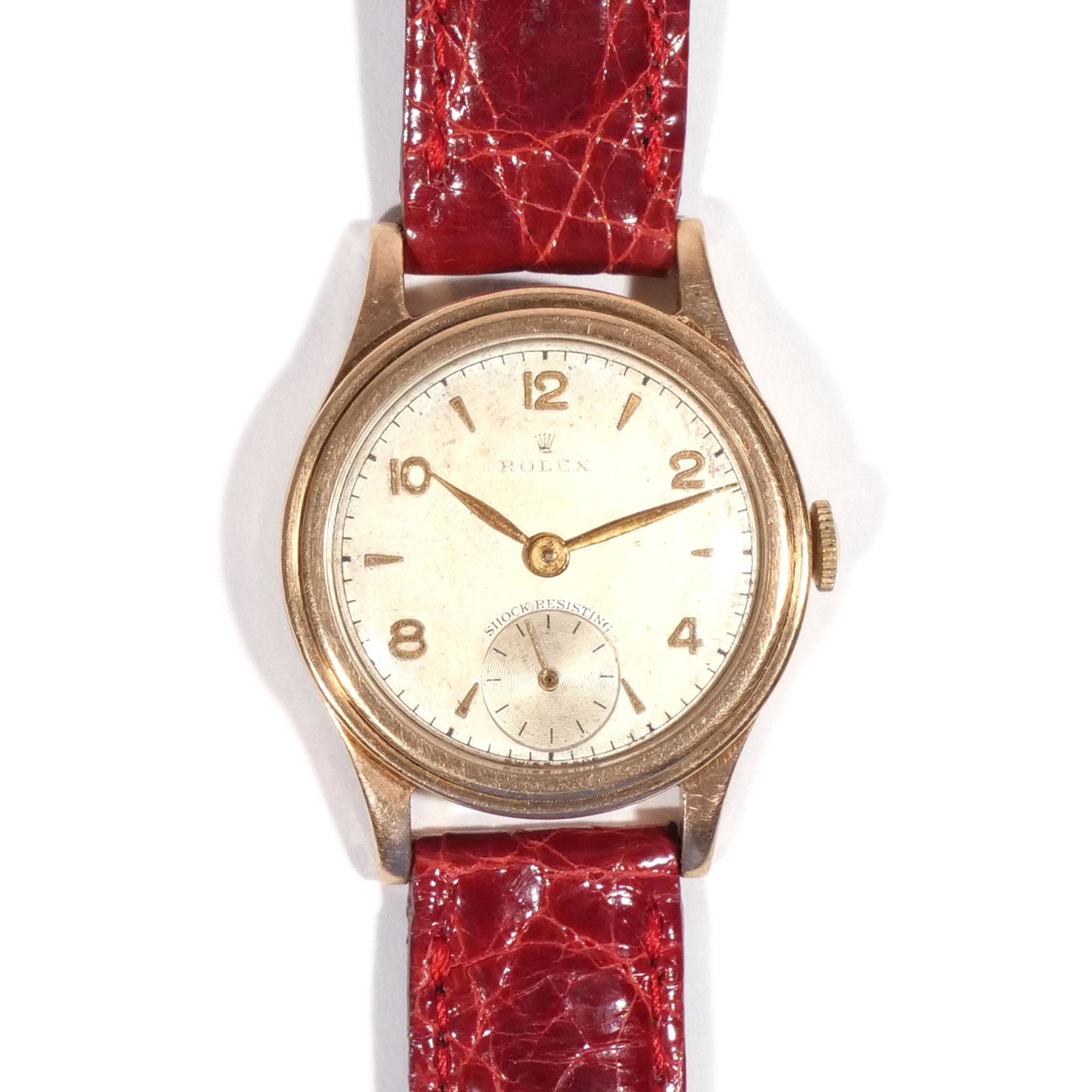 VINTAGE ROLEX "SHOCK-RESISTING": Weathered silver dial with Roman and baton numerals, sub-seconds dial, gold engraved case (dia. 29mm over crown), total weight approx. 28.2g, later band Provenance: Private collection, Pawling, NY