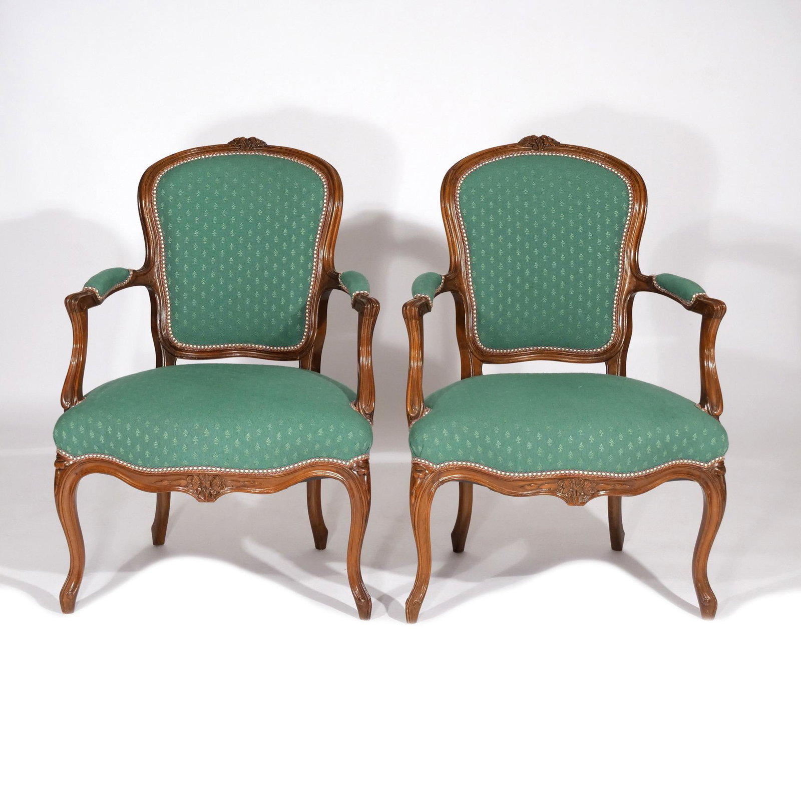 PAIR LOUIS XV-STYLE FAUTEUILS: Early-mid 20th century, with green upholstered seats, back rests, and arm pads h. 35-1/2 w. 26 d. 24 in. Provenance: Descended through a Greenwich, CT family [In Situ Item] This item will not be on di