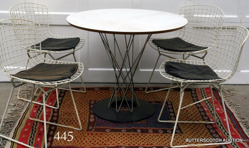 ISAMU NOGUCHI "CYCLONE" DINING TABLE: DIA. 36", H. 29", PLUS 4 HARRY BERTOIA WIRE CHAIRS, ALL 4 W/ ORIGINAL SEAT COVERS; BOTH MANUFACTURED BY KNOLL INTERNATIONAL, CIRCA 1950.