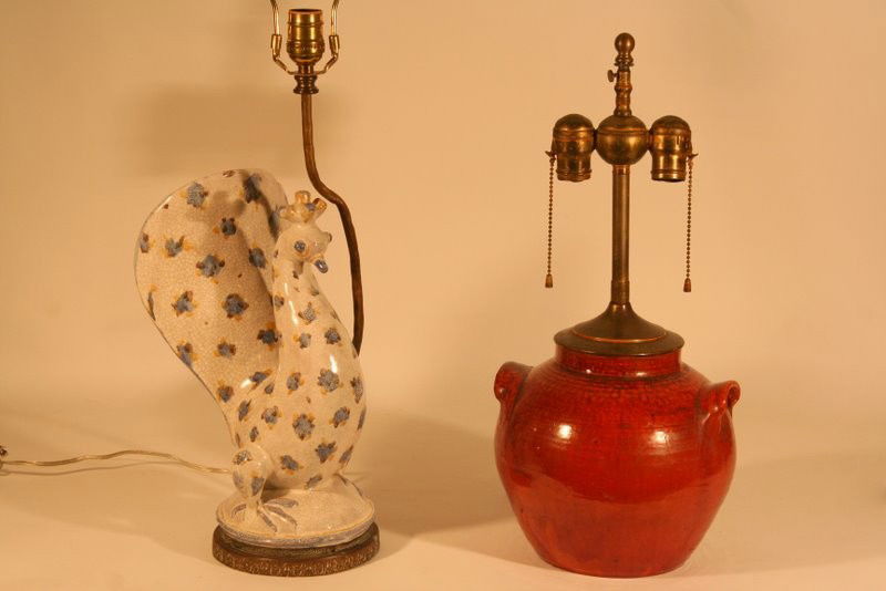 TWO DECORATIVE LAMPS: 1 CERAMIC PEACOCK, H: 14", THE OTHER AN ORANGE GLAZED EARTHENWARE VASE (DRILLED), 9" W/ A CHIP