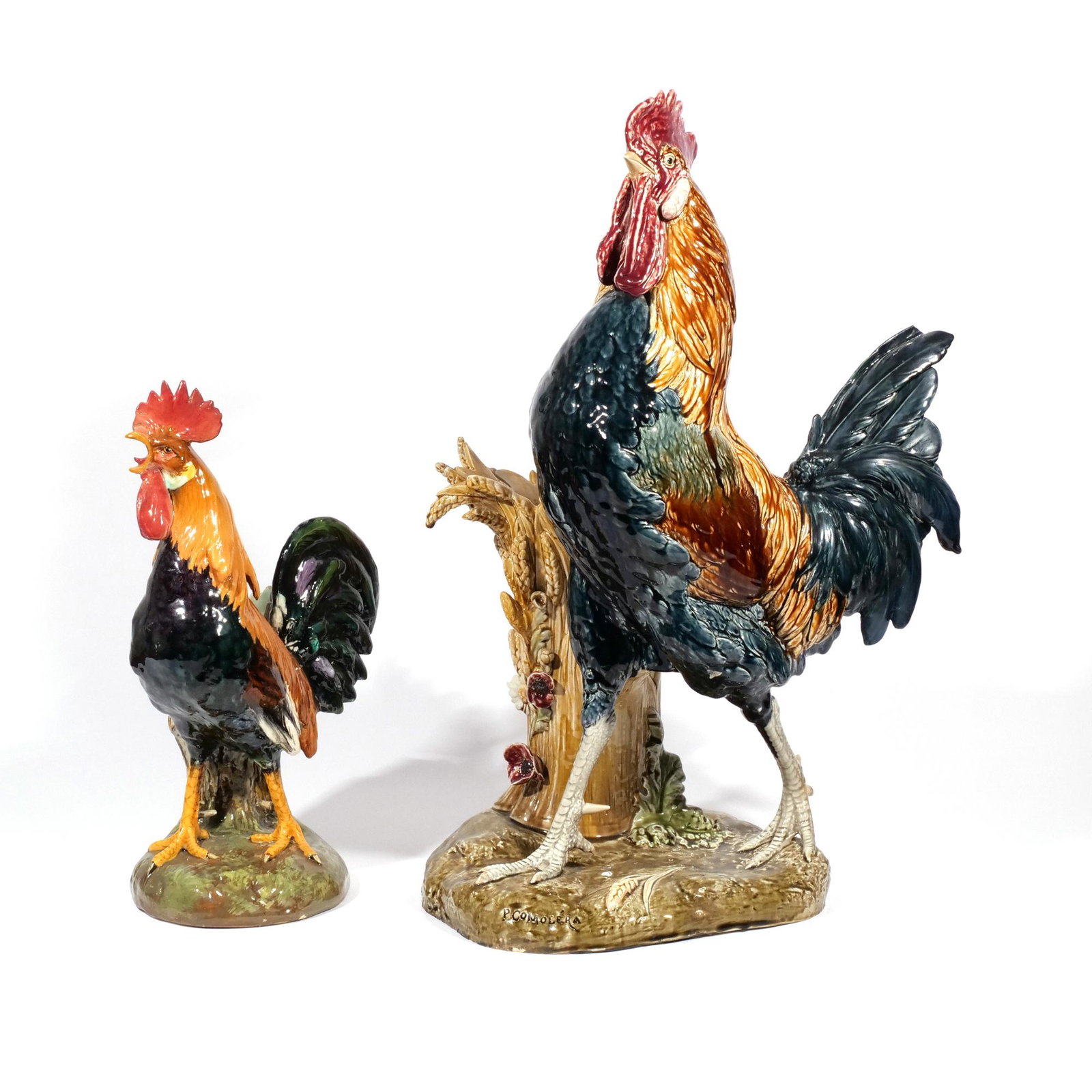 (2pc) MONUMENTAL FRENCH MAJOLICA ROOSTERS: Circa 1875, both after a model by Paul Comolera, including a Choisy-le-Roy model of a cockerel beside a vase, model no. 1281, black printed signature and various incised marks (h. 26 w. 17 d. 14 in.);