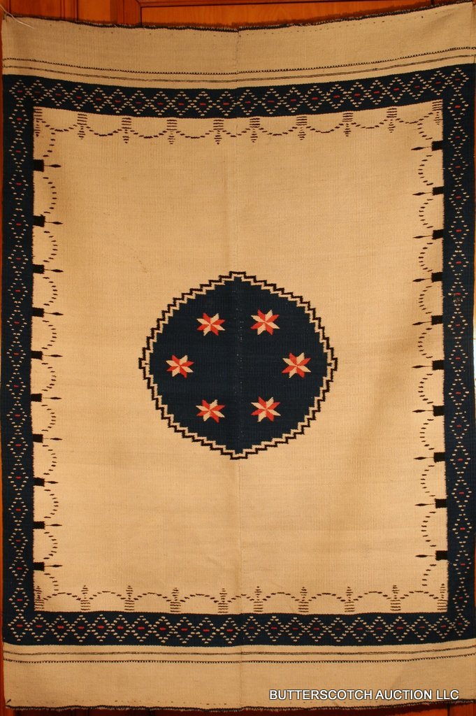 20TH C. MEXICAN SALTILLO 2 PC. SERAPE, CENTRAL: ROUNDEL FILLED W/SNOWFLAKE MOTIF, WITHIN CREAM FIELD AND TRELLIS INNER BORDER AND DIAMOND OUTER, - 71 X 49'
