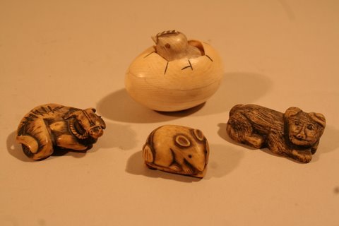 LOT 4-NETSUKES: RECUMBENT OX, W/DMGD. EAR,: CHICKEN IN EGG, NEAT SEPARATION; RECLINING MONKEY, ANTIQUE CARVED IVORY NETSUKE OF FIELD MOUSE ON LEAF, CARVED IN THE RND. W/OLD REPAIR PROV.: GEORGE SARTON & ELEANOR MARBLE (ELWES) SARTON COLL.