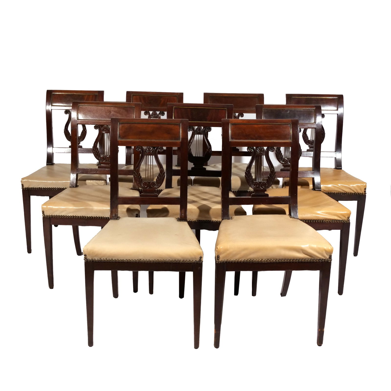 (9pc) SET FEDERAL MAHOGANY DINING CHAIRS: Early 19th century, school of Duncan Phyfe, crest rails with inset panels outlined with brass, over carved lyre, flanked by shaped stiles, over upholster seat, resting on square tapering legs; seat he