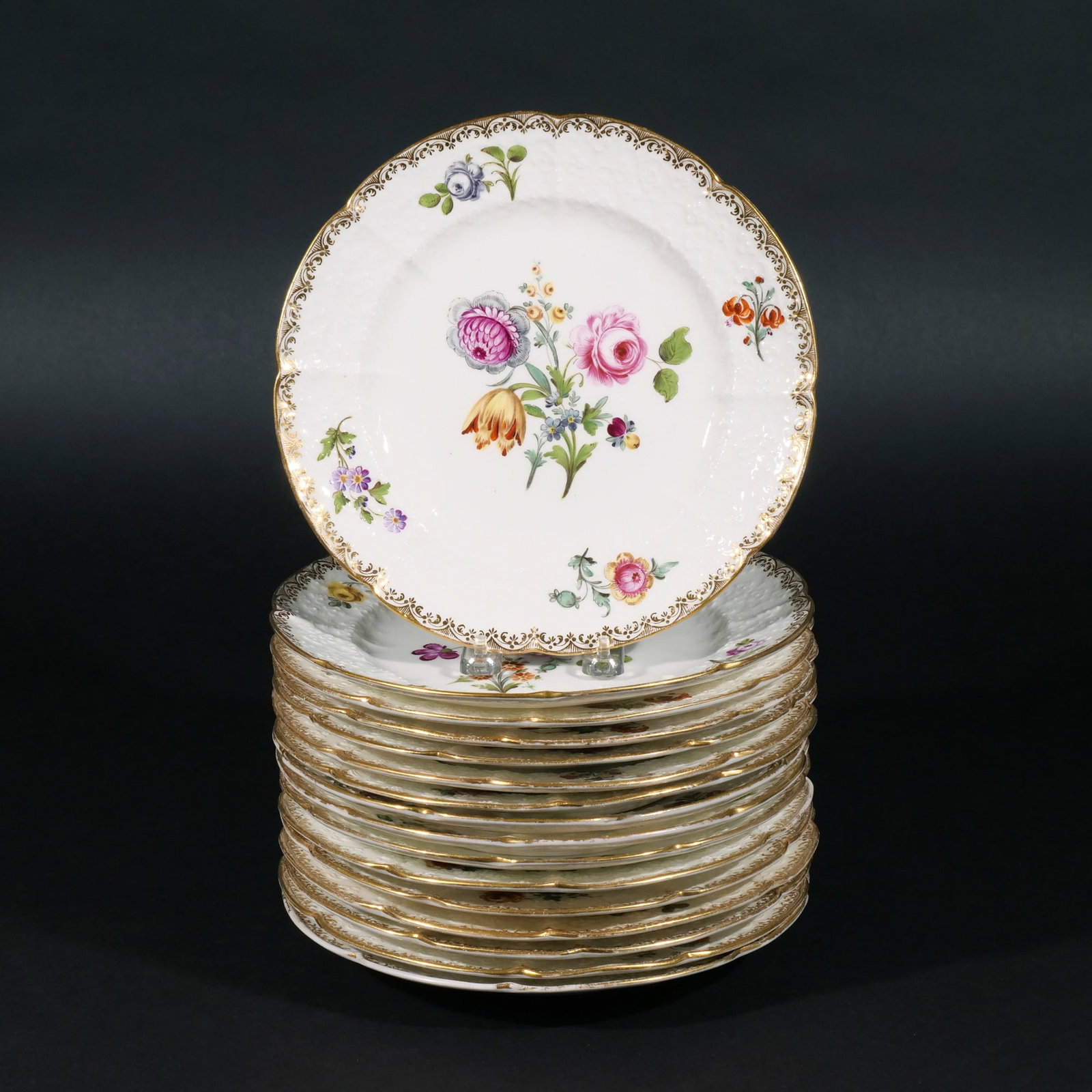 (16pc) PORCELAIN FLORAL PLATES, 19th century: A set of sixteen floral plates, all with different floral centers dia. 10 in. Provenance: Purchased at Sotheby's by the consignor; Private collection, Greenwich, CT [In Situ Item] This item will not b