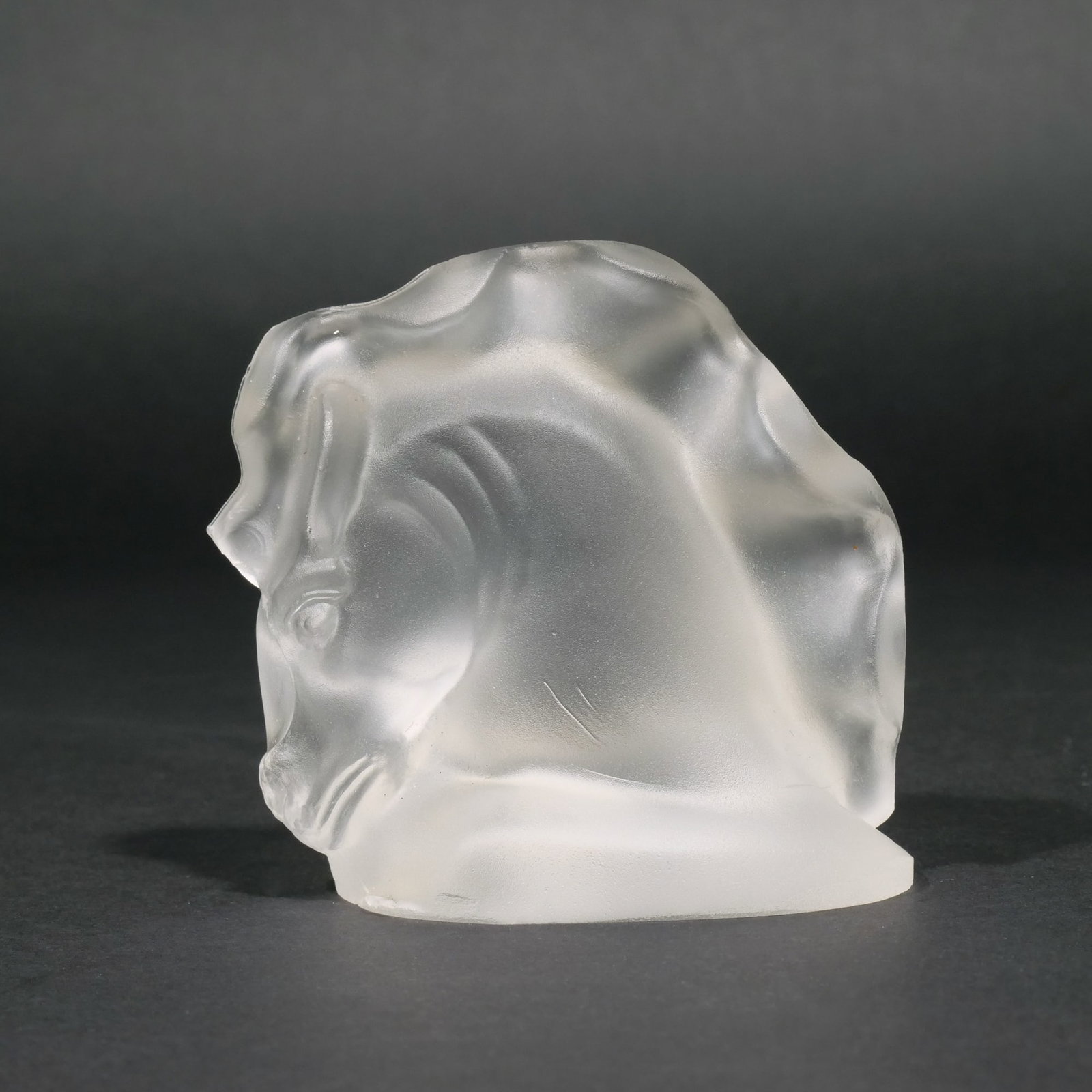 STEUBEN FROSTED HORSE-HEAD: Signed, "Steuben / F. Carder", with old label reads: Rockwell's, Corning, NY h. 4 w. 4 in. [In Situ Item] This item will not be on display in our saleroom during our preview period. If you wish to vie